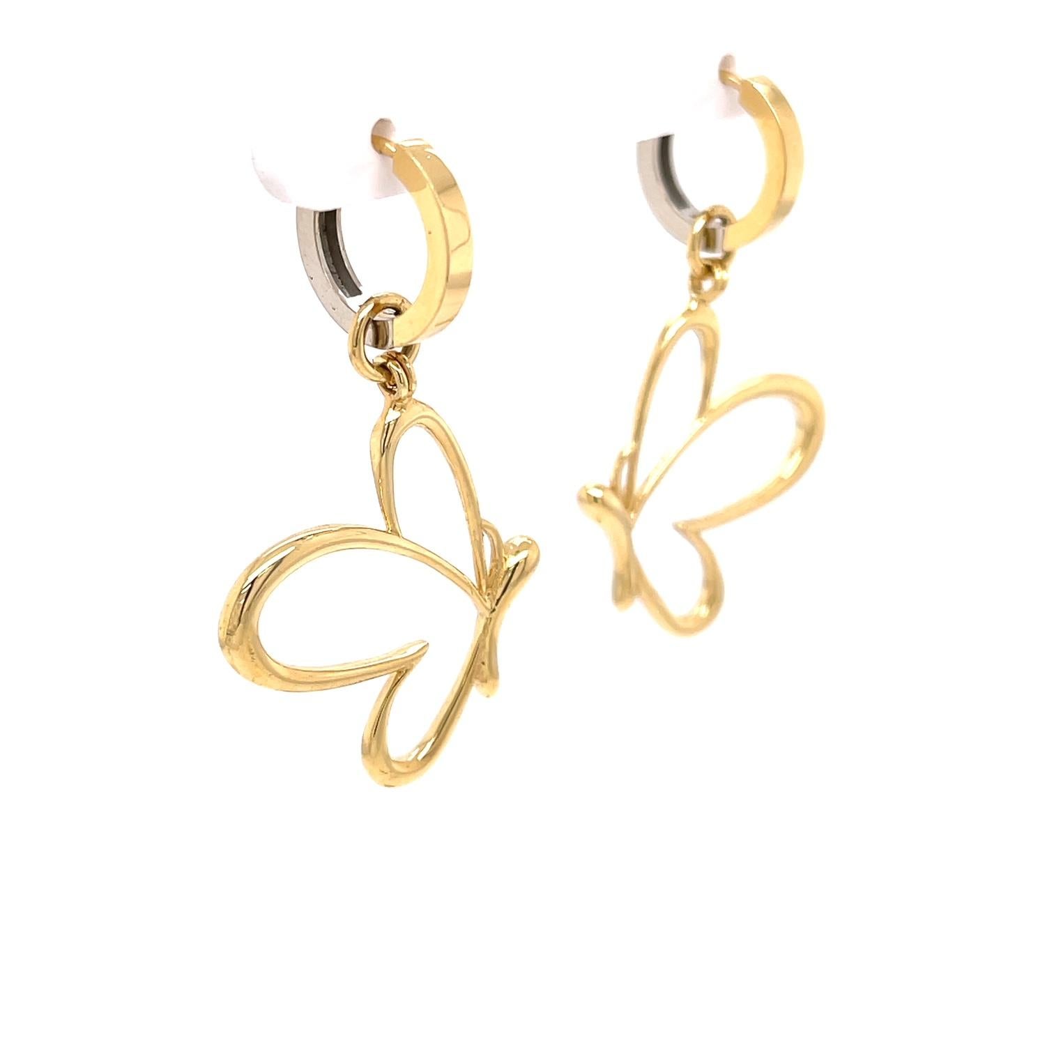 A pair of 18k yellow and white gold reversible huggie hoops with a pair of 18k yellow gold butterfly jackets. These earrings were made and designed by llyn strong.
Items sold separately upon request.