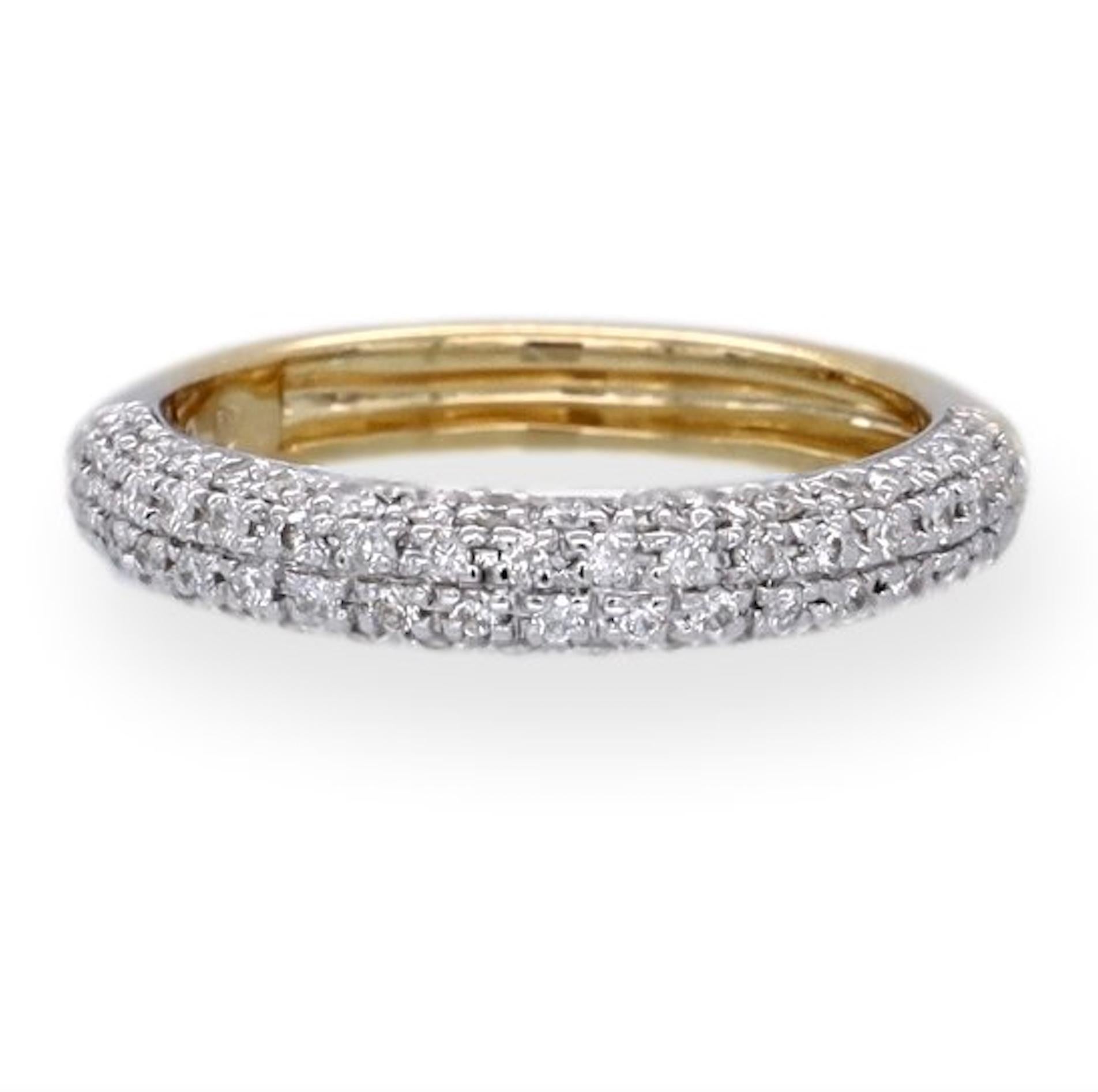 Band ring featuring a stunning combination of white and yellow gold finely crafted in two tone 18 karat gold boasting four rows of round brilliant cut diamonds weighing 0.51 carats total weight approximately, I-J color SI2-I1 clarity set in a pave
