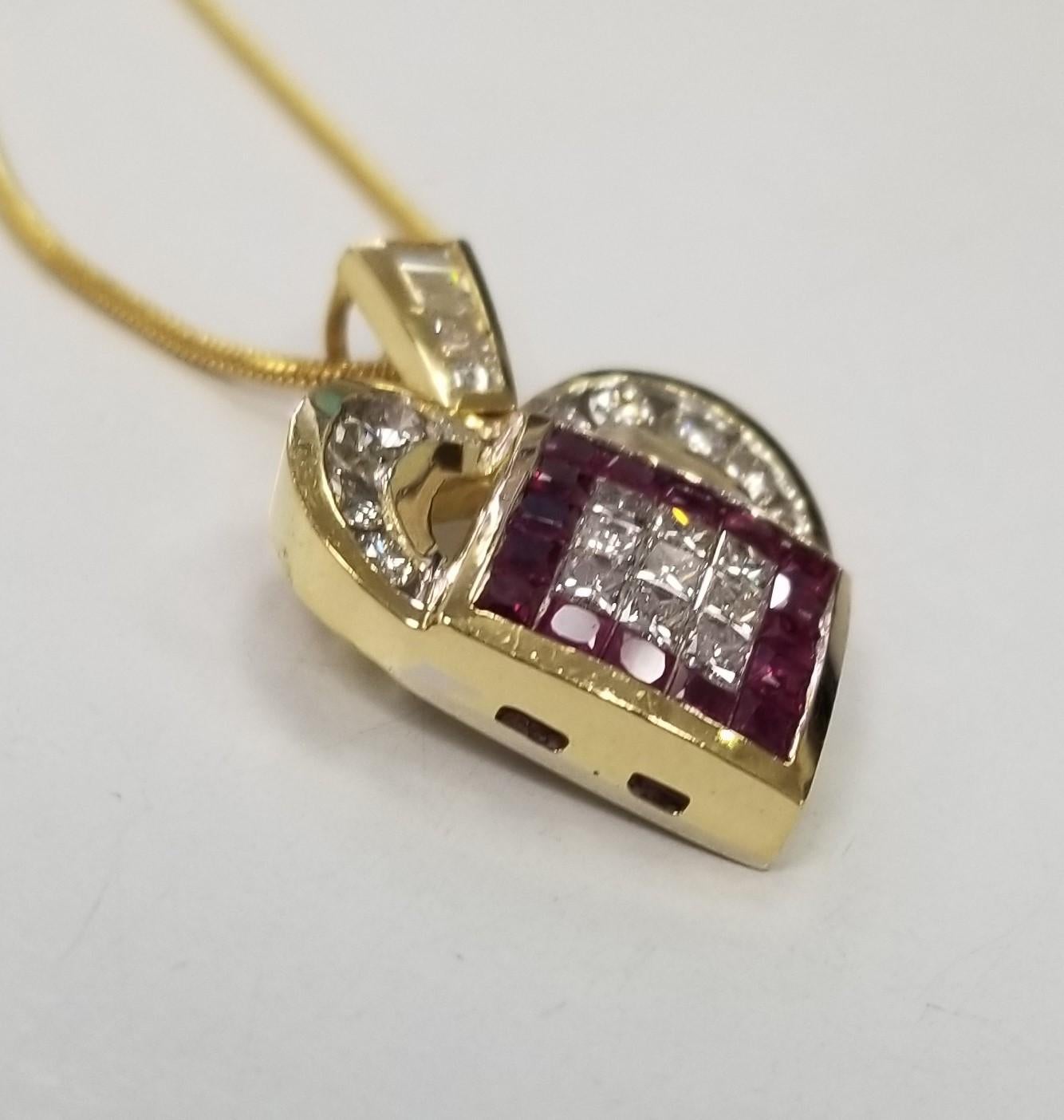 18K Yellow & White Gold Invisible set Ruby and Diamond Heart Pendant 2.00 Carat total weight, on a 14k yellow gold 16 inch snake chain.
*Motivated to Sell - Please make a Fair Offer*
Specifications:
Metal: 18K White and Yellow Gold
Colored Stones: