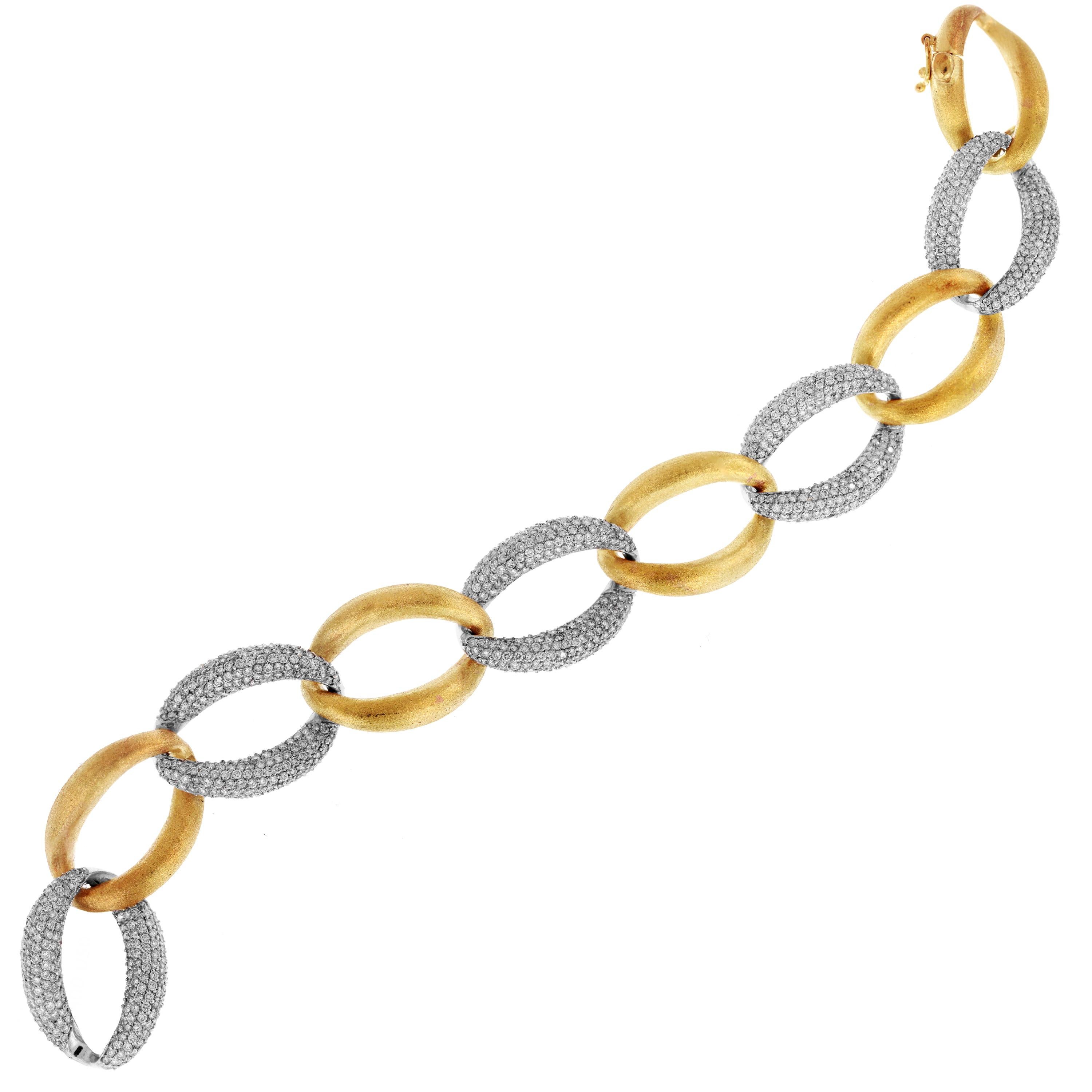 18K Yellow White Two Tone Gold Diamond Oval Links Bracelet

Stunning bracelet with brushed, matte finished yellow gold. White gold links are pavé set with diamonds all throughout

6.42 carat G color, VS clarity diamonds

Bracelet is 8 inches in