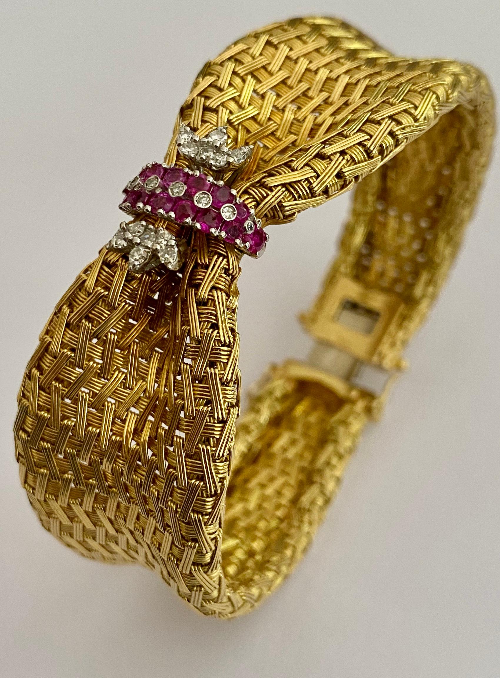 One (1) 18K. Yellow and White Gold Bracelet stamped 0.750 and F.RC
set with 20 single cut diamonds = 0.30 ct  Vsi/Si - EF
              16 mixed cut round Ruby's = 1,05 ct ( no heating and origin = Burma)
Weight of the Bracelet: 62.86
