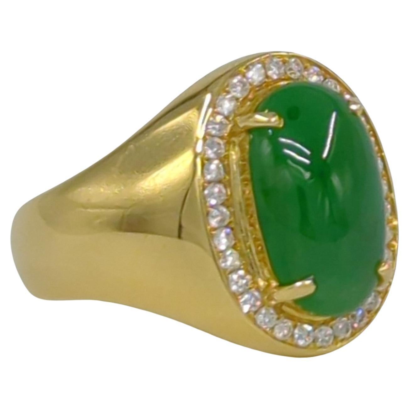 This exquisite ladies' ring is crafted in 18K white gold and weighs 6.50 grams. It features a stunning oval cabochon of intense green jadeite at its center. The jadeite is of A-grade quality, as certified by the NGTC (National Gemstone Testing