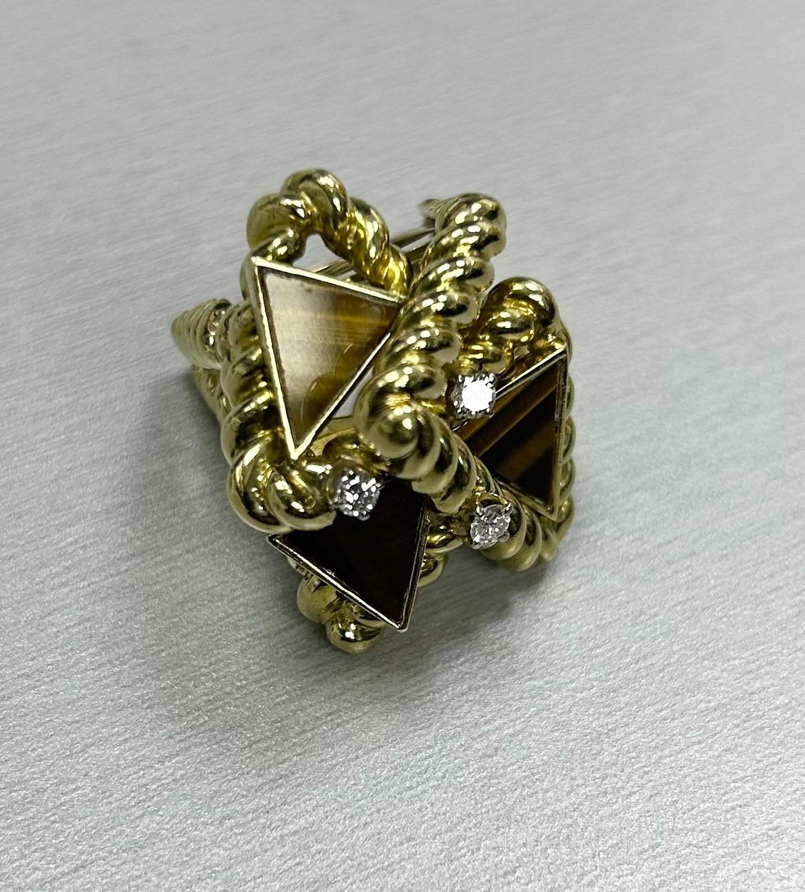 Unique 1970s large looking abstract 18k YG ring with 3 small diamonds, 3 triangle shape tiger eye, weighing 31.8g with some kind of marking, size 7.75 (with ring guard)
