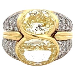 18K YG Two-Stone Ring with 8.27ct Fancy Yellow Oval and White Round Diamonds GIA