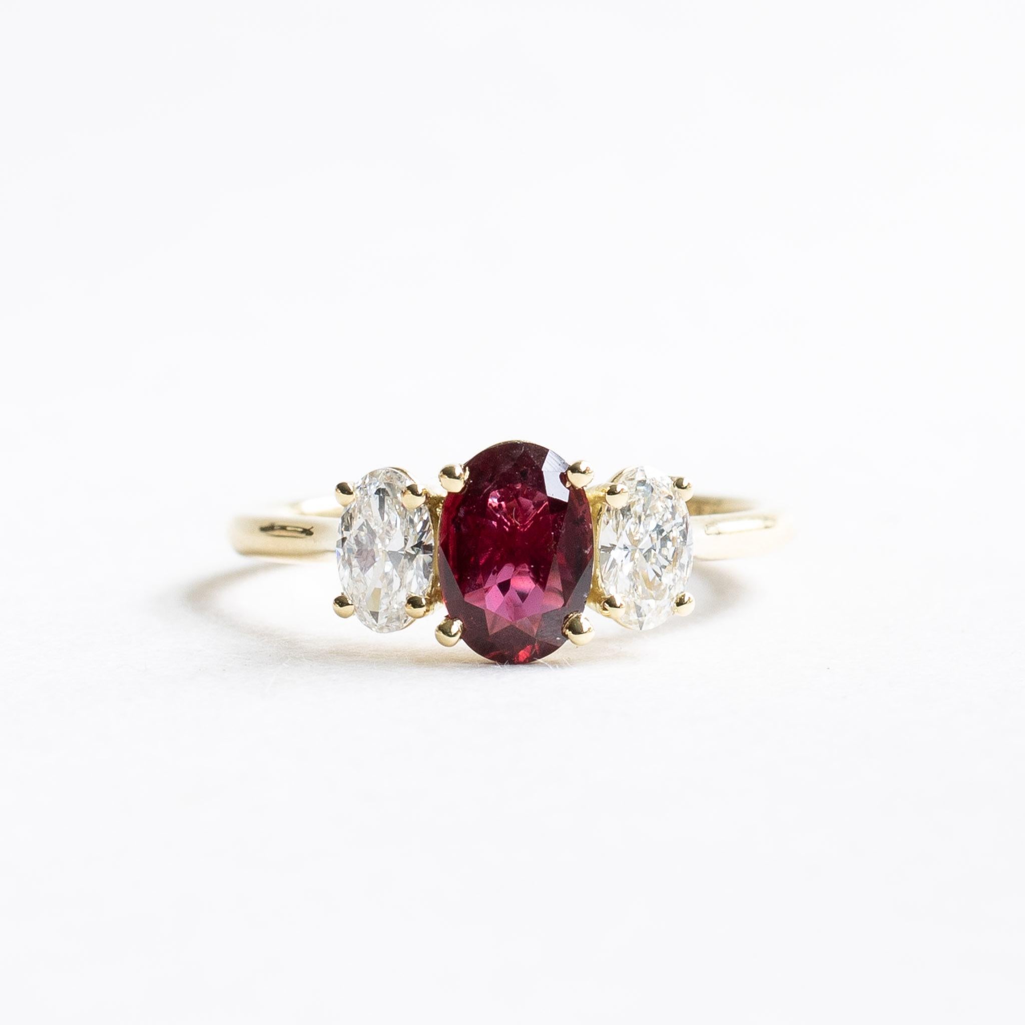 Three stone ruby diamond ring

Metal: 18k Yellow Gold
Stone: Natural Ruby
Stone Shape: Oval
Stone Color: Vivid Red Pigeon Blood
Ruby Weight: 1.062 Carat
Side Stones: Natural Diamonds
Diamond Color and Clarity: D-F, VVS
Diamond Weight: 0.50 total