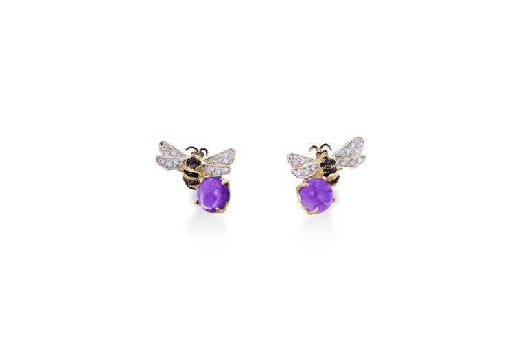 18 Karat Yellow Gold Amethyst 0.16 Karat White Diamond 0.18 Karat Black Diamonds Bees 
a pair of Bees Stud Earrings handcrafted in 18 Karats Yellow Gold and adorned with a deep violet amethyst stone, white and black diamonds. 
Dimensions: 0.08 in.