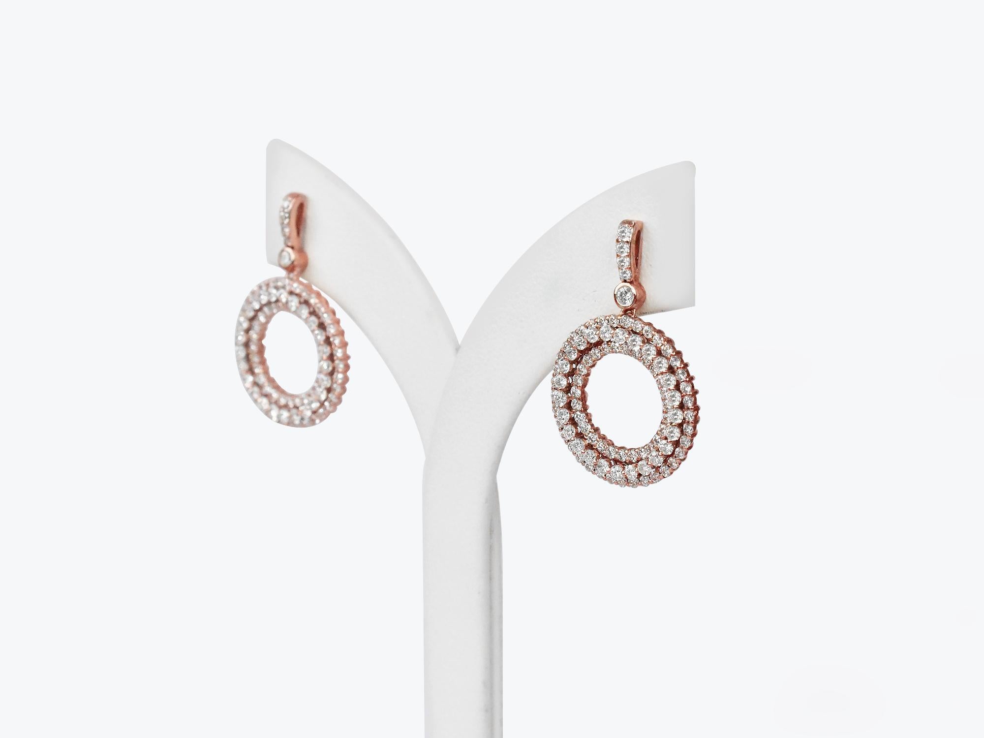 18Karat Gold Dangle Earring Rose Gold Cluster Double Halo Circle Diamond Earring
         This 18K solid 2 tone gold, rose/white gold circle earring is made with spectacular round diamonds, clasped within a fine multi halo of pavé stones.   
       