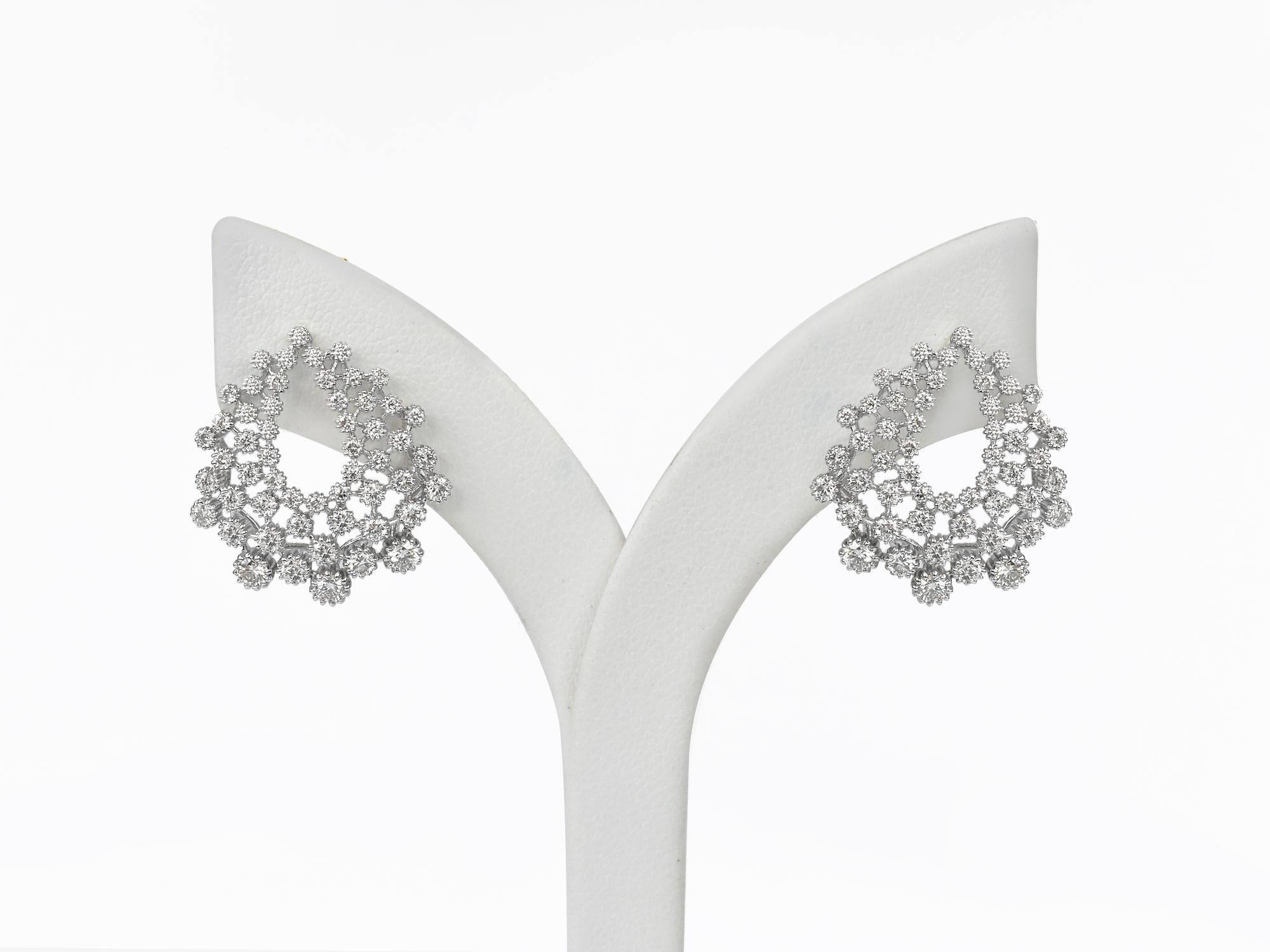18Karat Gold Earring White Gold Diamond Pave Fashion Earring
     A fashion Art Nouveau earring is fully paved with brilliant-cut diamonds set in stunning 18K white gold. Sculptural arrangements of diamonds designed to enchant and enthrall by Oshi
