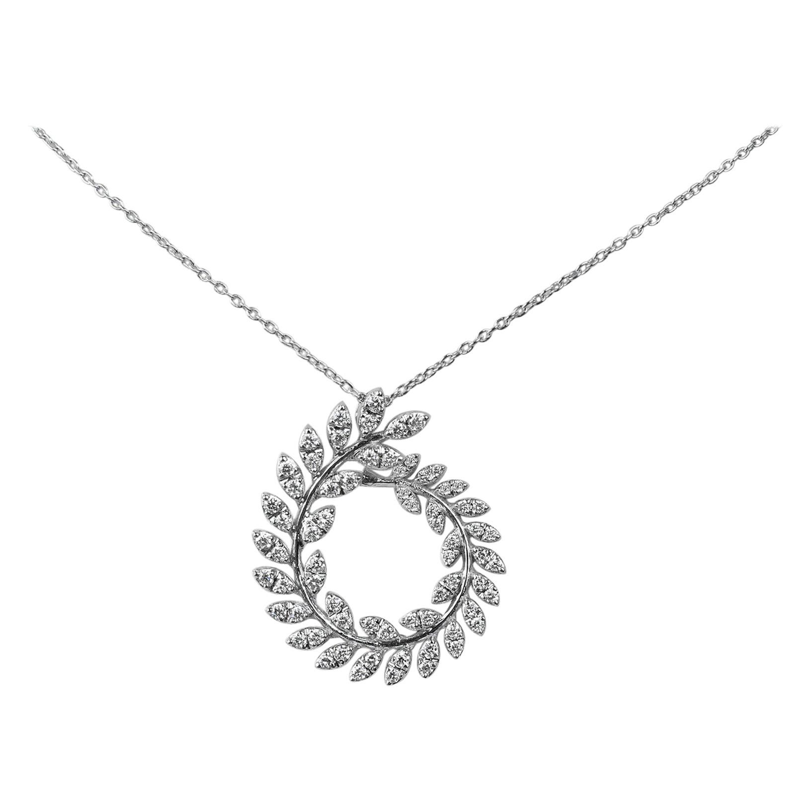 18Karat Gold Pendant Necklace White Gold Diamond Pave Leaf Fashion Pendant Necklace
           This 18K solid white gold leaves circle pendant is a fancy shape made of brilliant diamonds that have remarkable sophistication, depth, and brilliance.
  