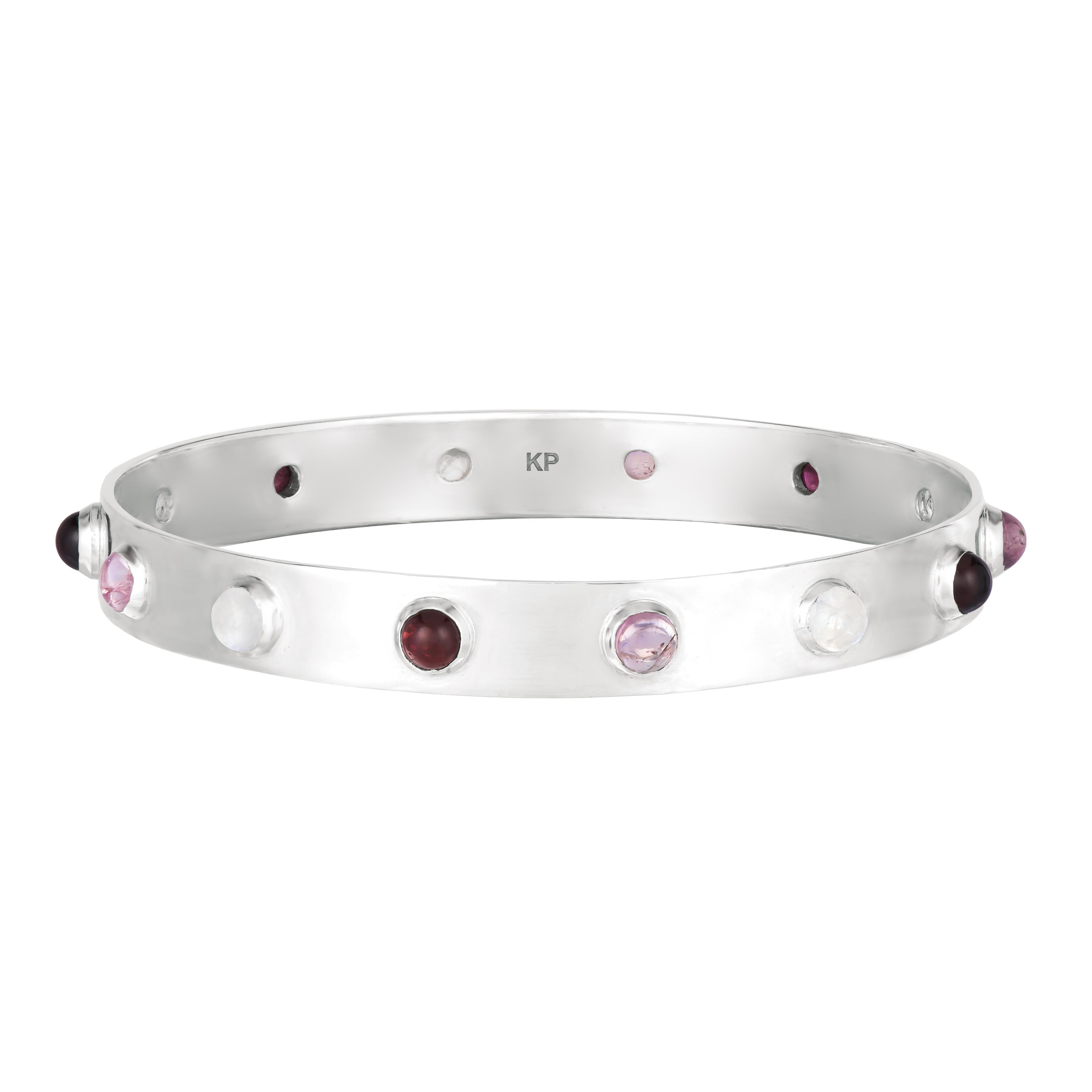 This bangle in 18K gold plate is the ideal accessory to a daytime or evening outfit, thanks to its sleek style, it is easy to slide on and take off. Its all-around stones feature a vivid splash of colors with cabernet red garnet, lemon citrine, rose