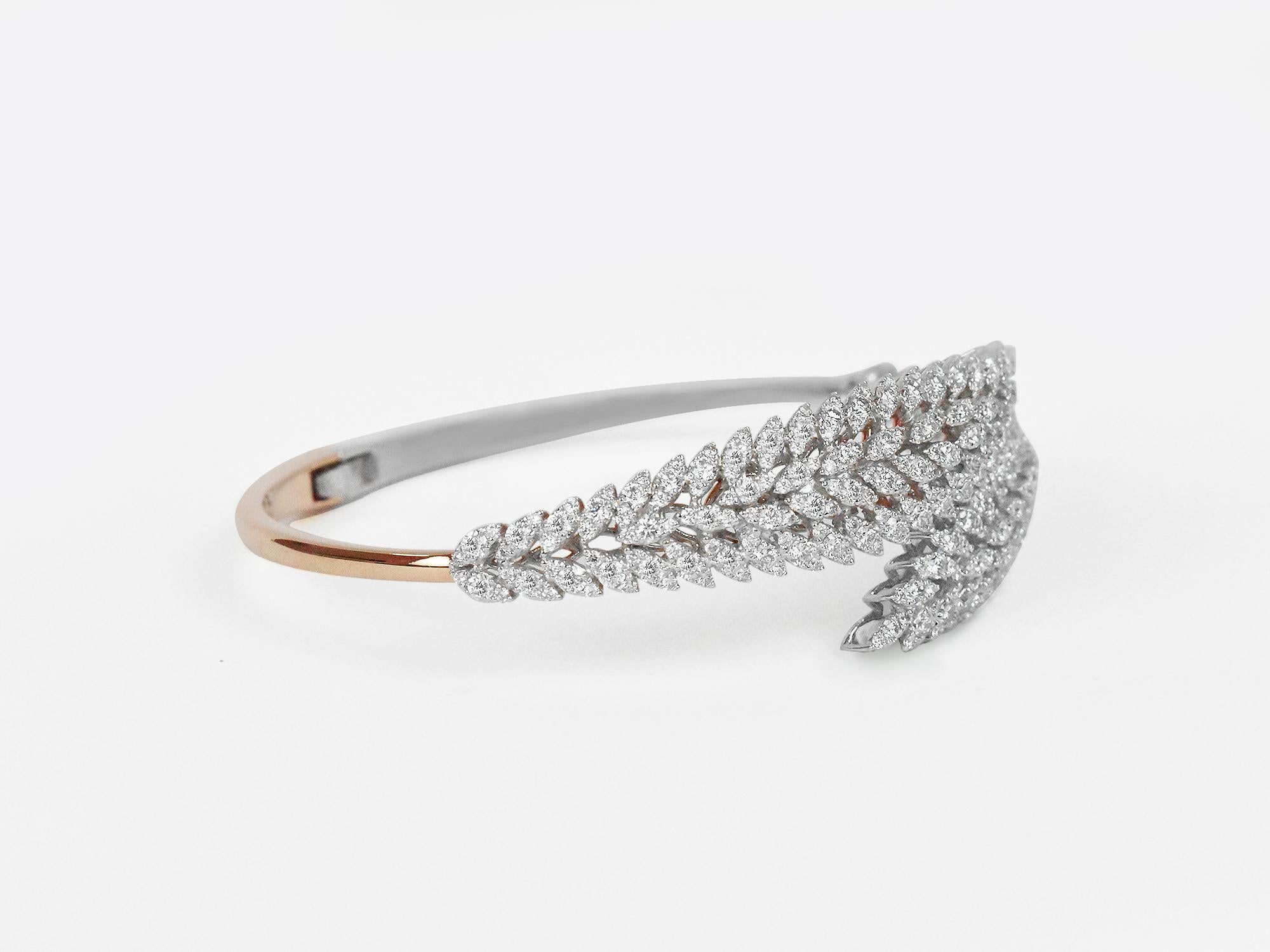 18Karat Gold Two Tone Rose Gold White Gold Diamonds Pave Fashion Bangle Bracelet
     This 18K solid gold,  2 Tone ( Rose Gold & White Gold) Hinge Clamper bangle. A strong piece of jewelry for years, decades & generations to wear this piece. Created