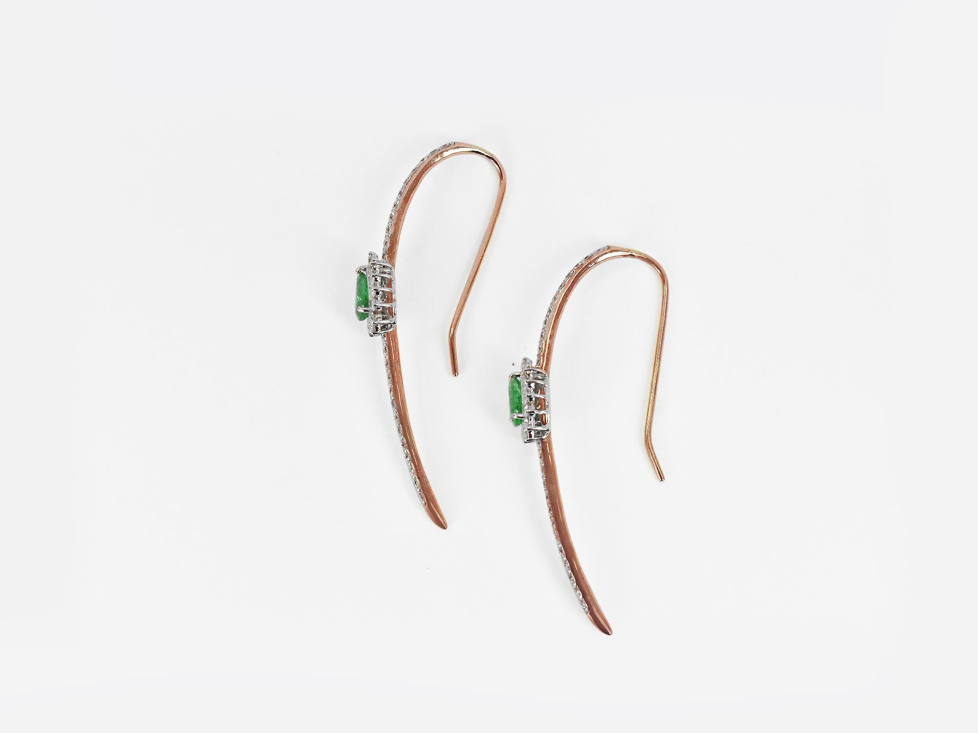 18karat Gold Two Tone White Gold Rose Gold Long Earring Long Bar Emerald Oval Diamond Pave Earring
     An 18K 2 tone, solid white / Rose Gold, emerald bar earring with dazzling halo set diamonds. An elegant piece of jewelry for enjoying life every