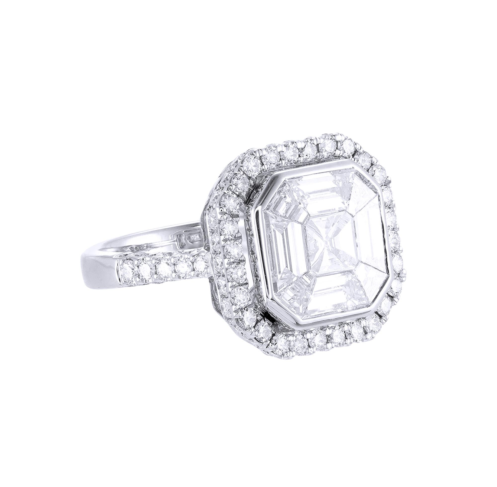 This diamond ring has a Asscher shape Illusion to create the look of 5.00 to 5.50 carat single Asscher cut stone surrounded beautifully with brilliant round diamonds, Handcrafted in 18 kt white gold, the total diamond weight of this ring is 2.77