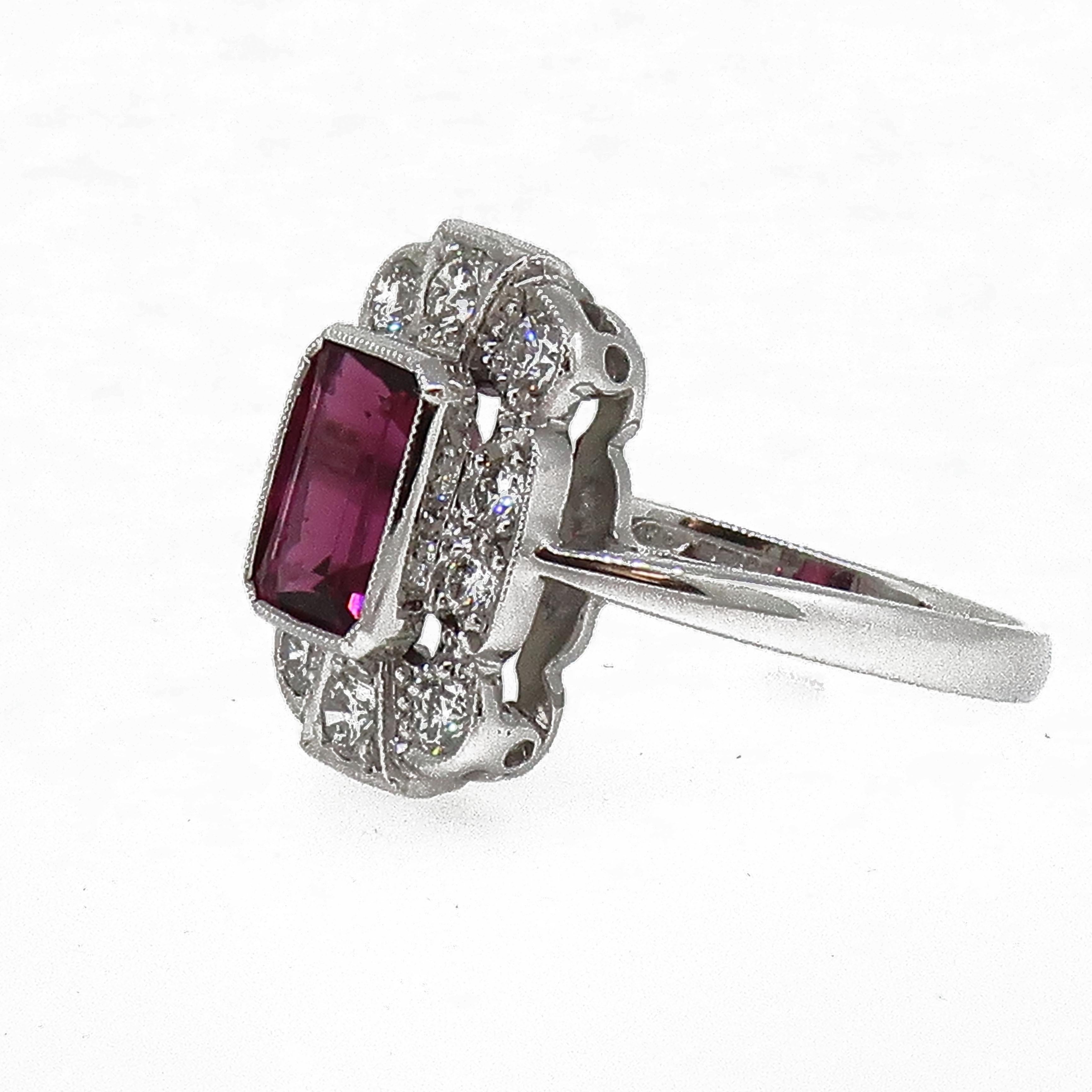 18Karat White Gold Rubellite Tourmaline & Diamond Art Deco Style Cluster Ring

A striking emerald cut rubellite / pink tourmaline set in a fine millegrain setting weighing 2.14ct, surrounded by ten round brilliant cut diamonds all set in a fine