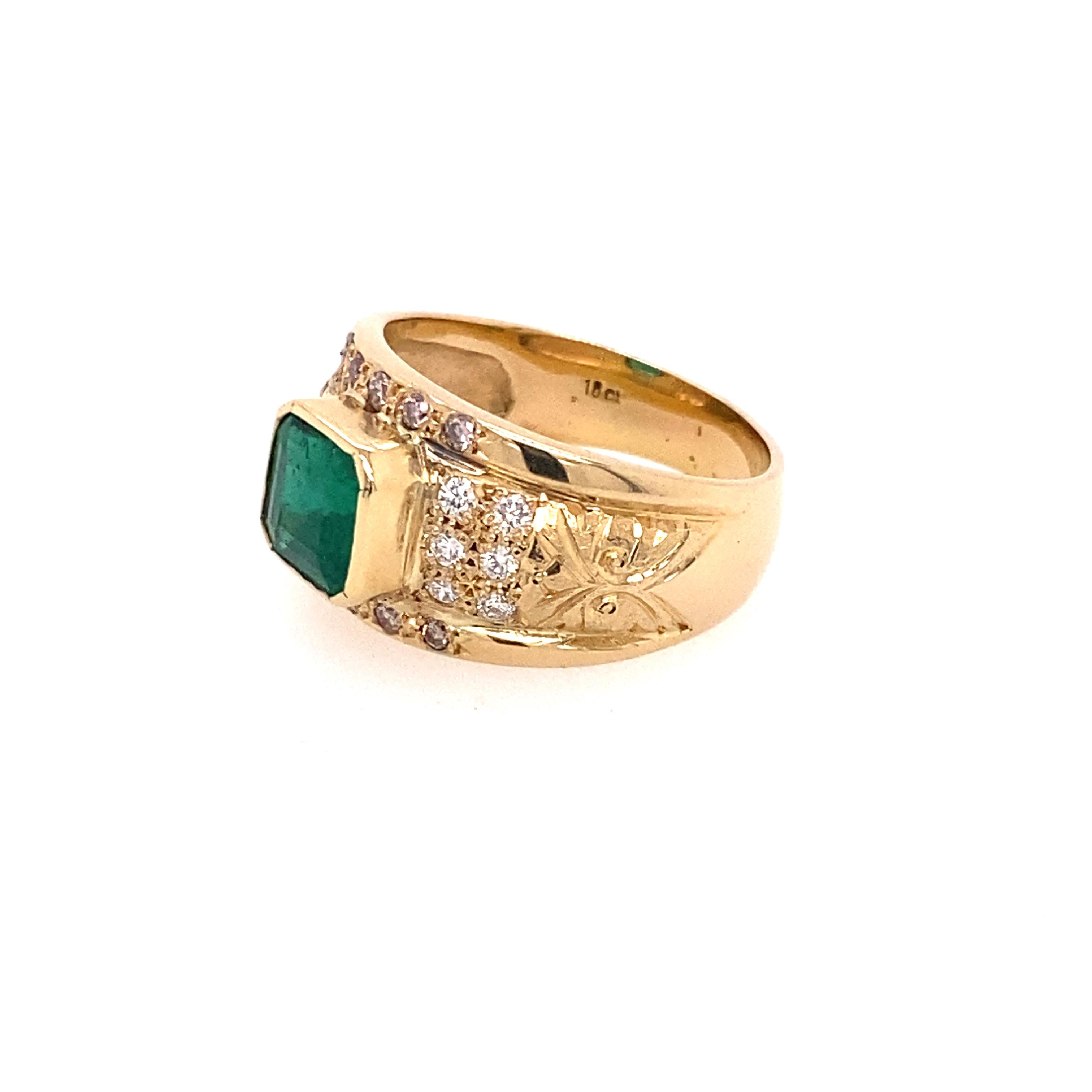 18 Karat Yellow Gold 2.10 Carat Emerald Diamond Ring

The center stone is a square emerald set in a bezel setting. An additional twenty two round brilliant cut diamonds are held in bezel and grain setting. Slightly dome band hand engraved on both