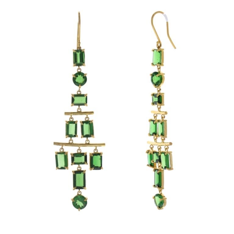 These contemporary chandelier earrings are filled with 20 emerald and round cut tsavorite garnets. The gem source is Tanzania. The color is vibrant forest green. The clarity and transparency are superb. Expertly matched and orientated for the