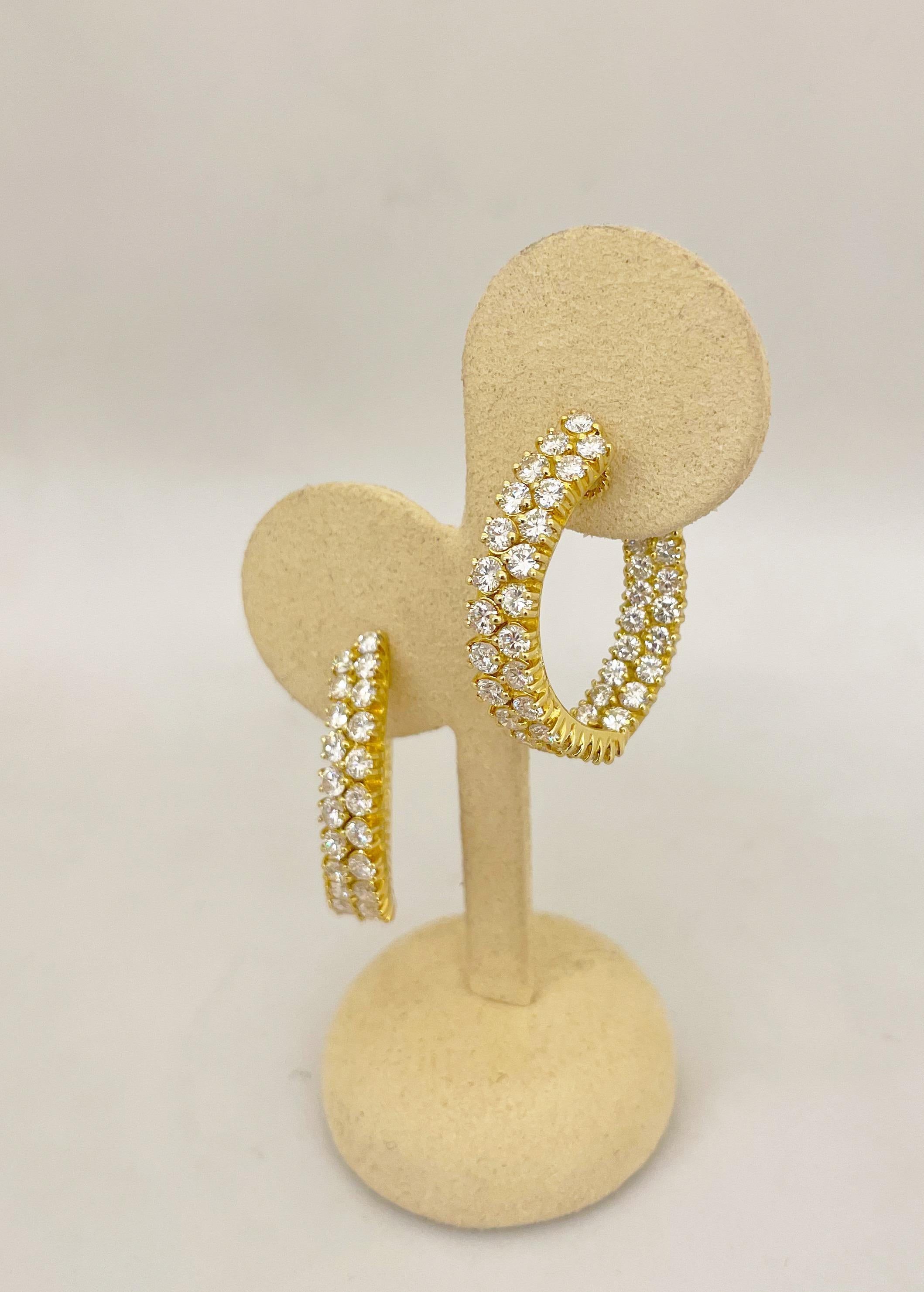 These show-stopping diamond hoop earrings feature 7.65 carats of round brilliant diamonds. The diamonds are set in 18KT gold and due to the way they are set diamonds are visible from any angle. 
Length 1.25