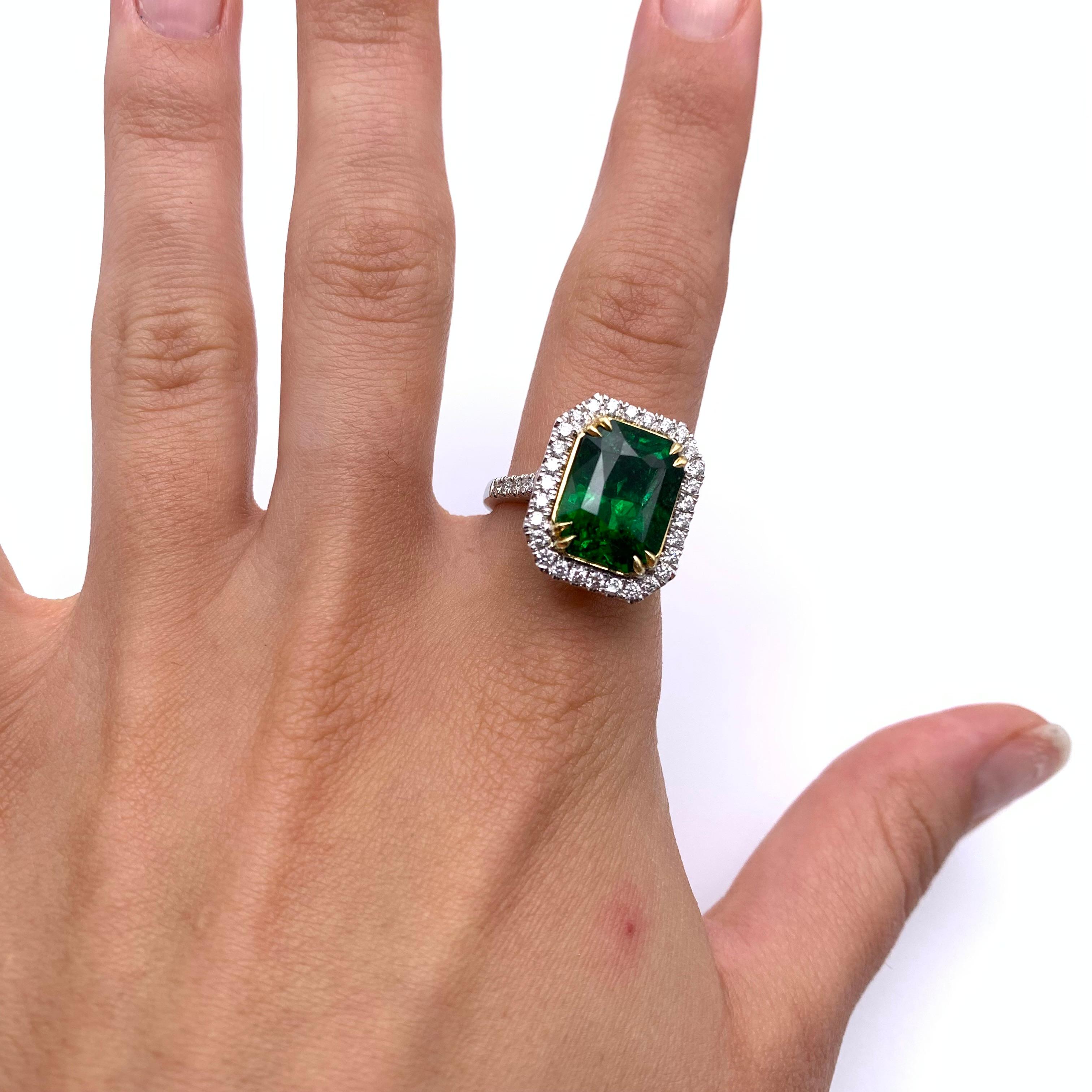 This stunning estate piece is truly a natural wonder! Set in a two-toned, 18-karat gold mounting is an 8.88-carat Tsavorite Garnet. Garnets are impervious to treatment. They cannot be heated or enhanced, thus this lush shade of green is completely