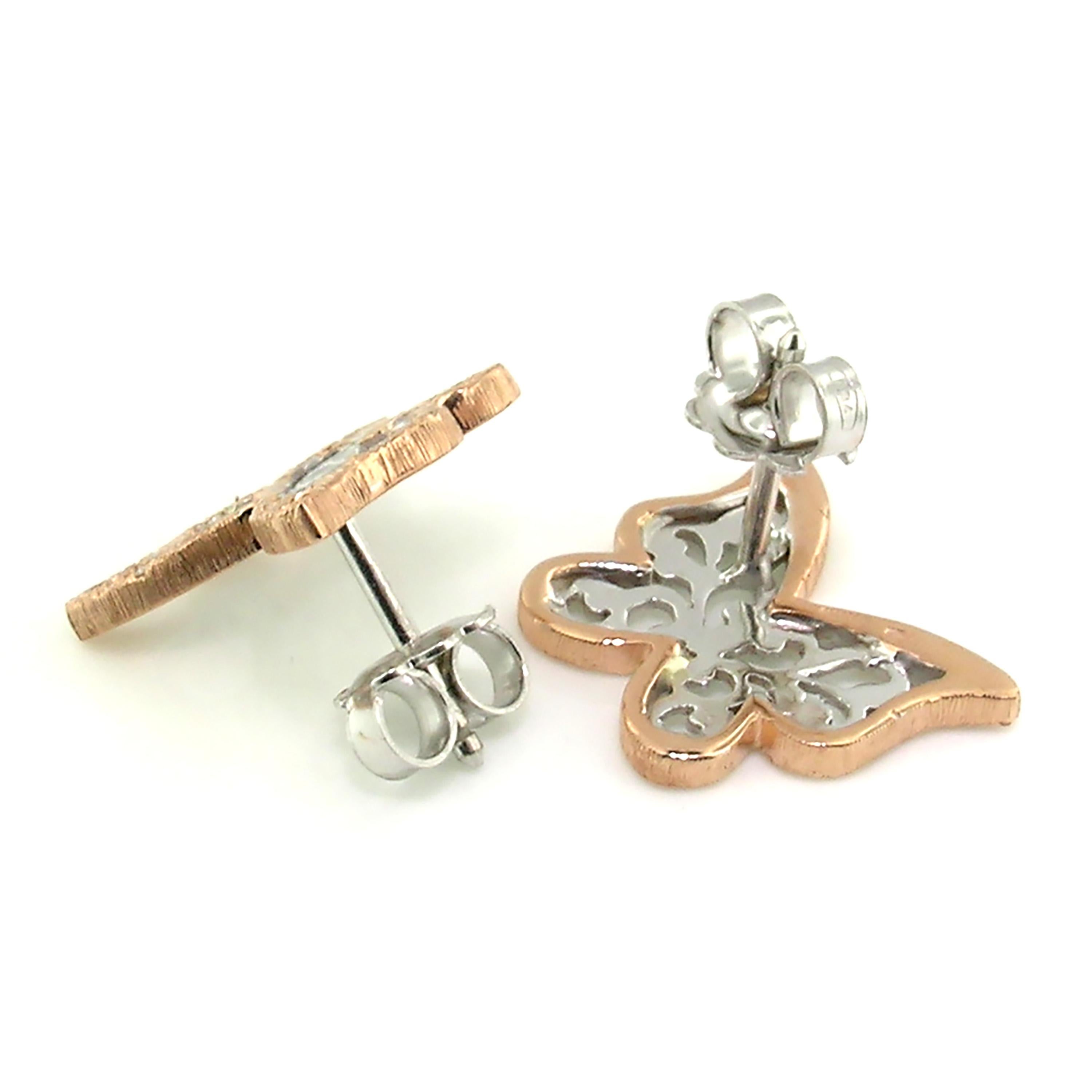 These airy Butterfly earrings appear to have gently alighted on the ear, poised to take flight. These charming butterflies are entirely finished with richly detailed Florentine engraving, and set with beautiful diamonds. 

-0.12ct of Diamonds
-18kt