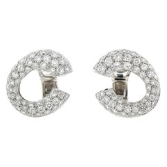 Boucles d'oreilles courbes en 18kt et diamants