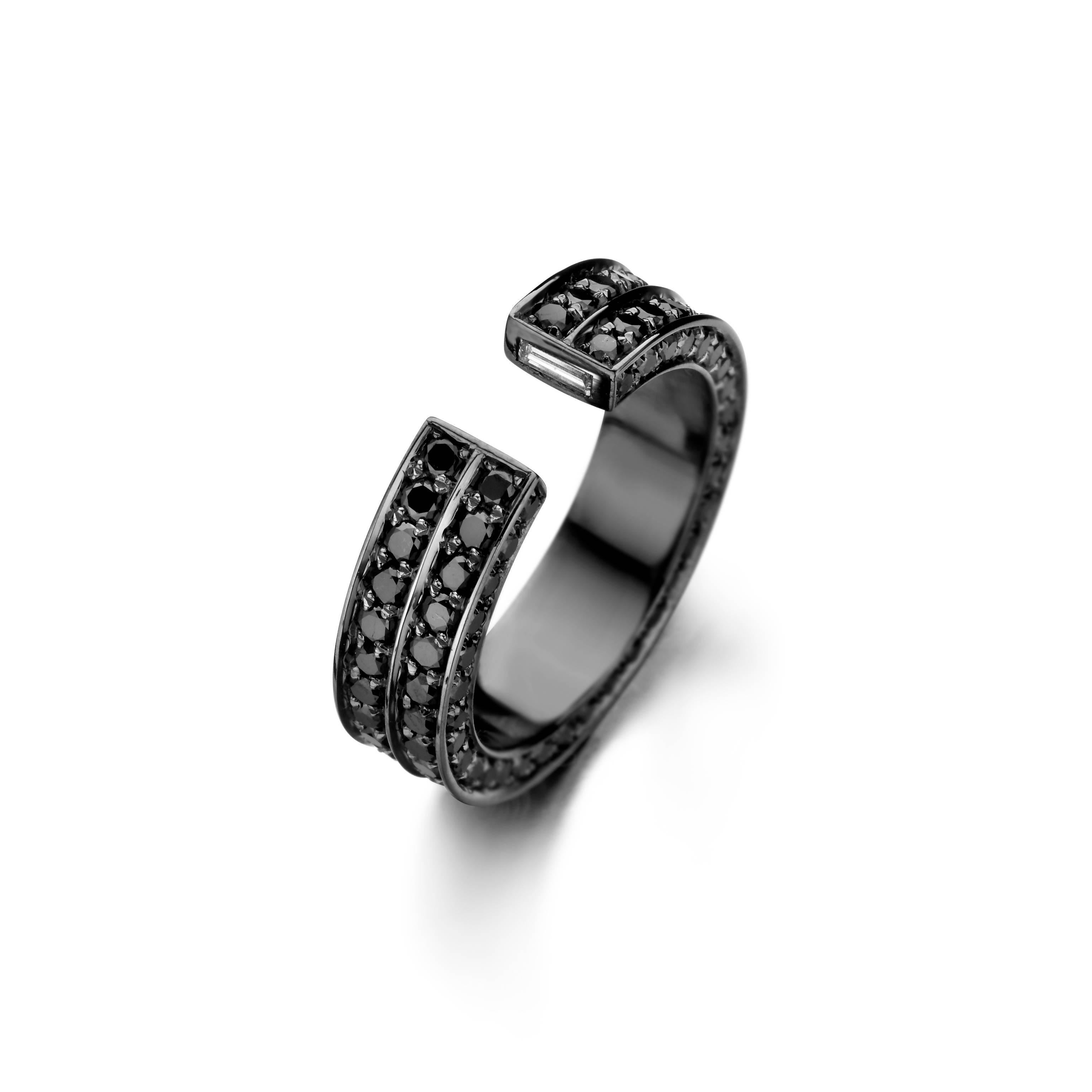 The BRUTE 18-karat gold ring has the appearance of two styles stacked together. Expertly handset with black diamonds and 2 baguette cut white diamonds, this piece is sure to make a refined statement. Wear yours solo.

Black, Natural Diamond 
Total