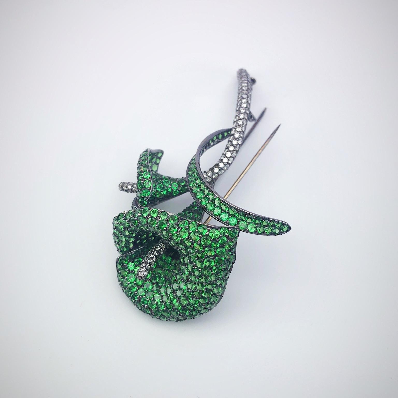 Round Cut 18 Karat Blackened Gold Calla Lily Brooch with Diamonds and Green Garnets