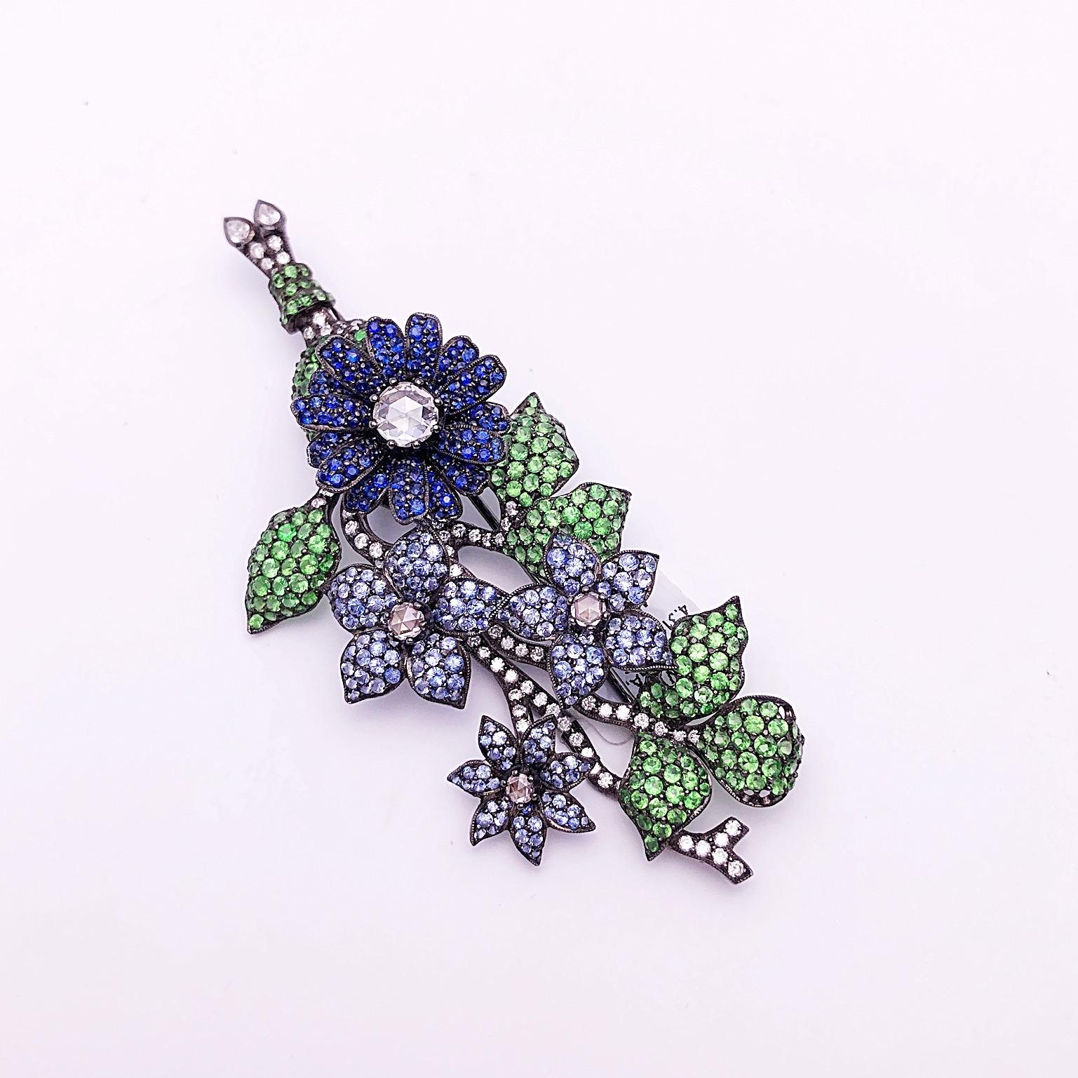 Modern 18Kt Blackened Gold Flower Brooch with Blue Sapphires, Tsavorites and Diamonds For Sale