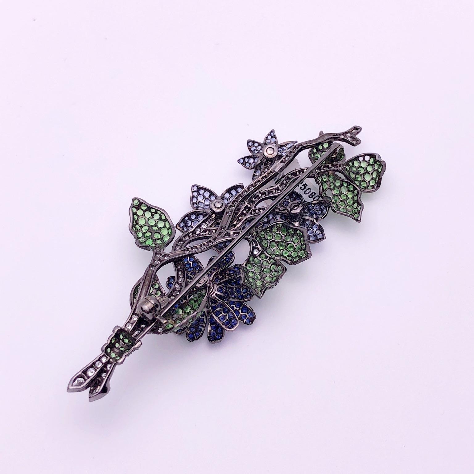18Kt Blackened Gold Flower Brooch with Blue Sapphires, Tsavorites and Diamonds In New Condition For Sale In New York, NY