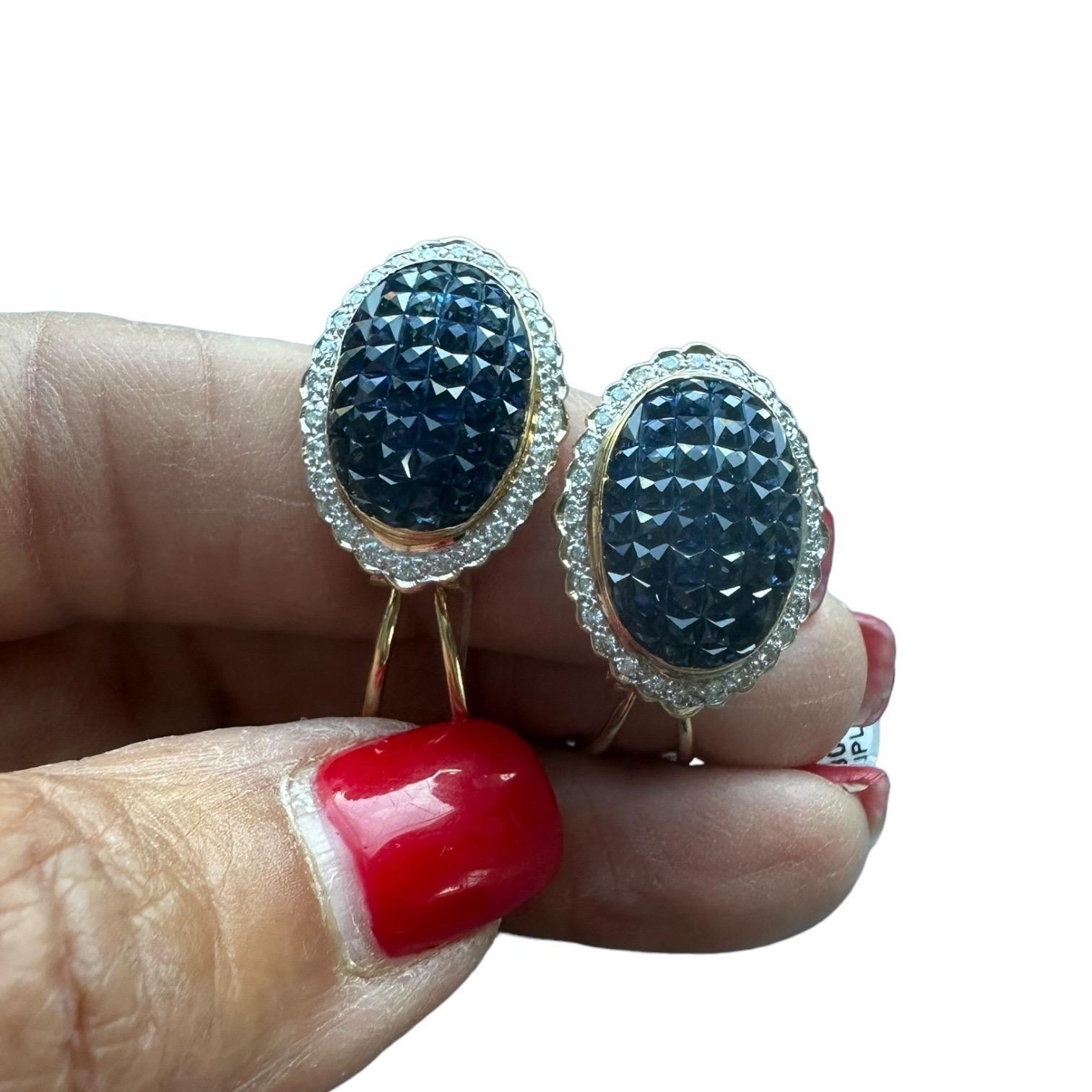 18KT Blue Sapphire and Diamond Invisible Set Earrings Clip or Posts
These fantastic colored sapphires are of pristine quality and set in a halo of diamonds.
Diamond quality is VS clarity and G color. The weight of the diamonds is approximately .75