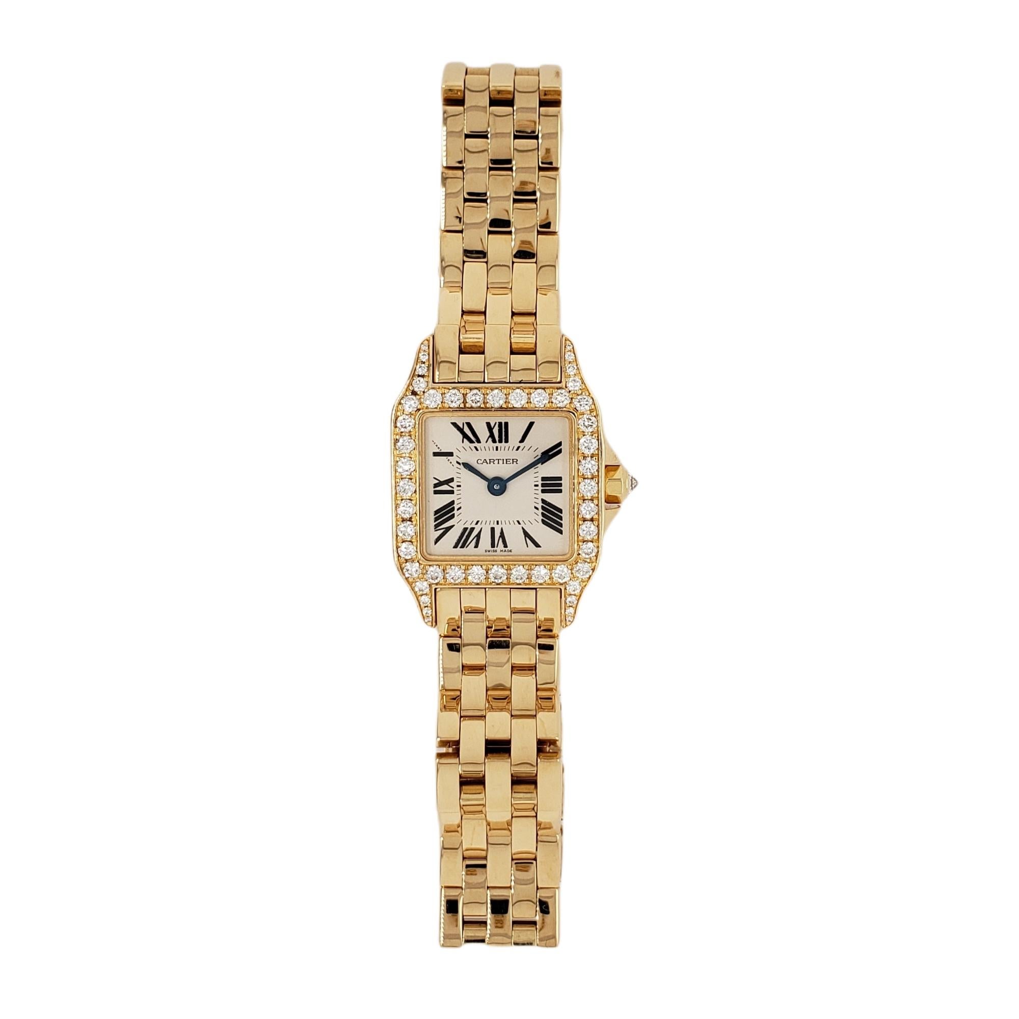 Cartier Santos Demoiselle in 18kt yellow gold featuring a diamond bezel, diamond lugs, and a diamond inverted crown. This timepiece is a quartz operated watch. Size 20mm x 28mm. Model # 2699. This Cartier has been expertly restored by our master