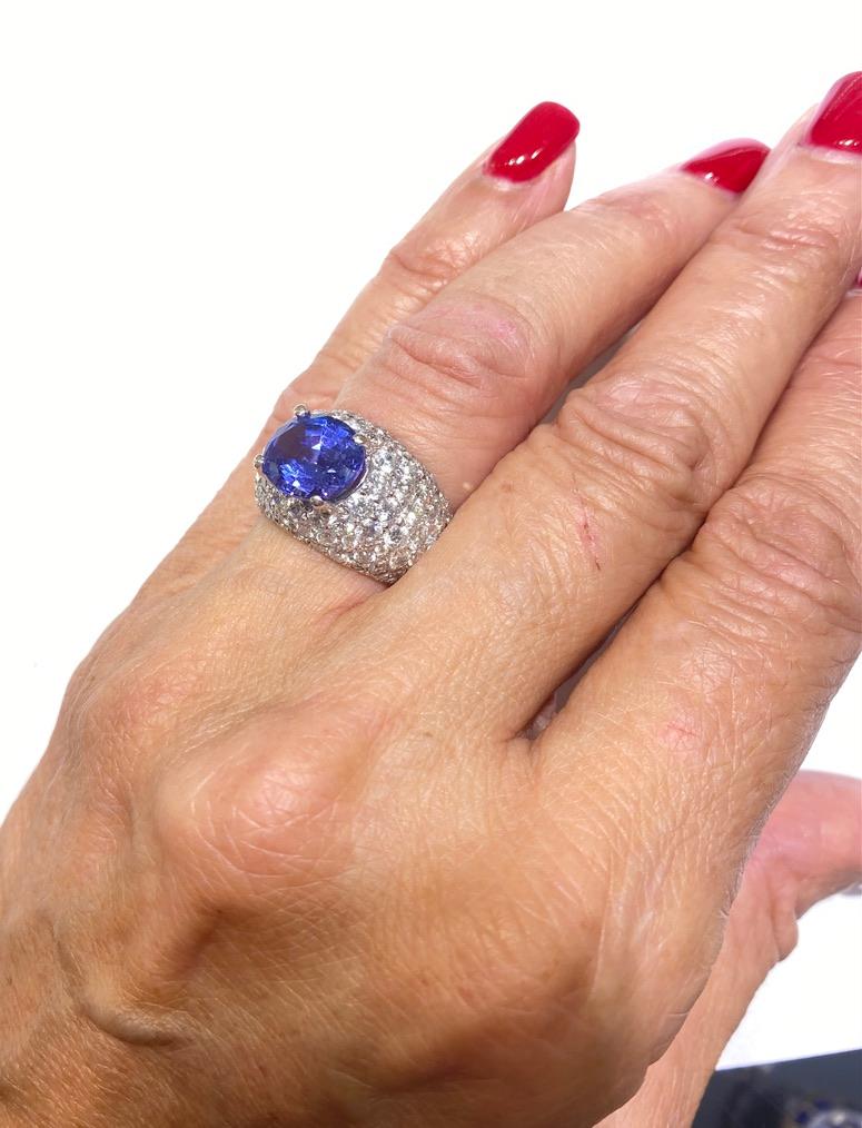 Contemporary Pave Diamond Ring with Tanzanite, Center Stone, 8.90 TCW, 18KT
The center Blue Tanzanite is measured as 9.31-11.27 x 6.80 mm with estimated weight of 5.10 carat. The tanzanite is deep quality colored with strong brilliant