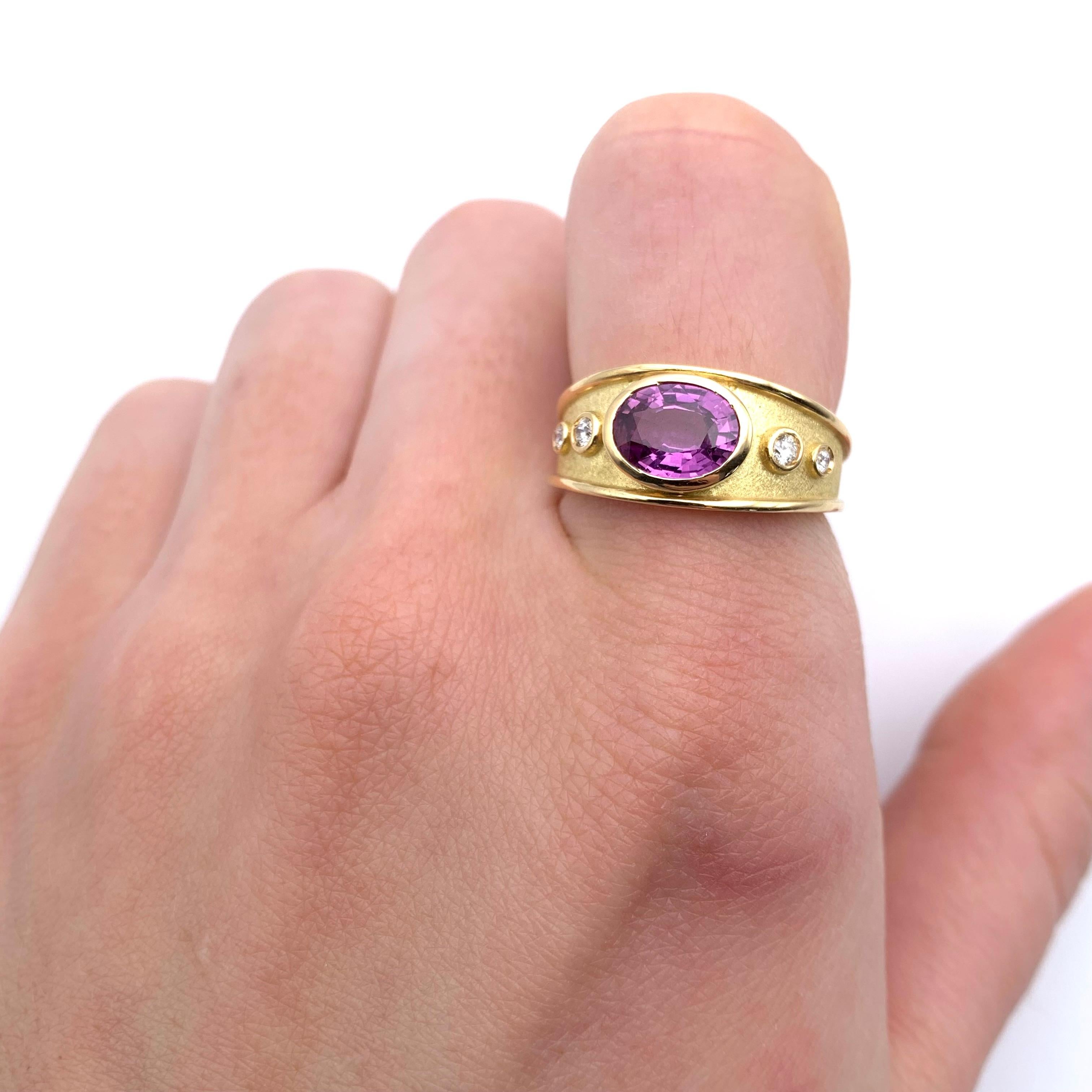 This Etruscan revival ring is a gorgeous addition to our Italian line. The piece was designed by our staff and beautifully executed by a multigenerational goldsmith in Florence, Italy.
The ring is bezel set with an oval-cut purple sapphire weighing