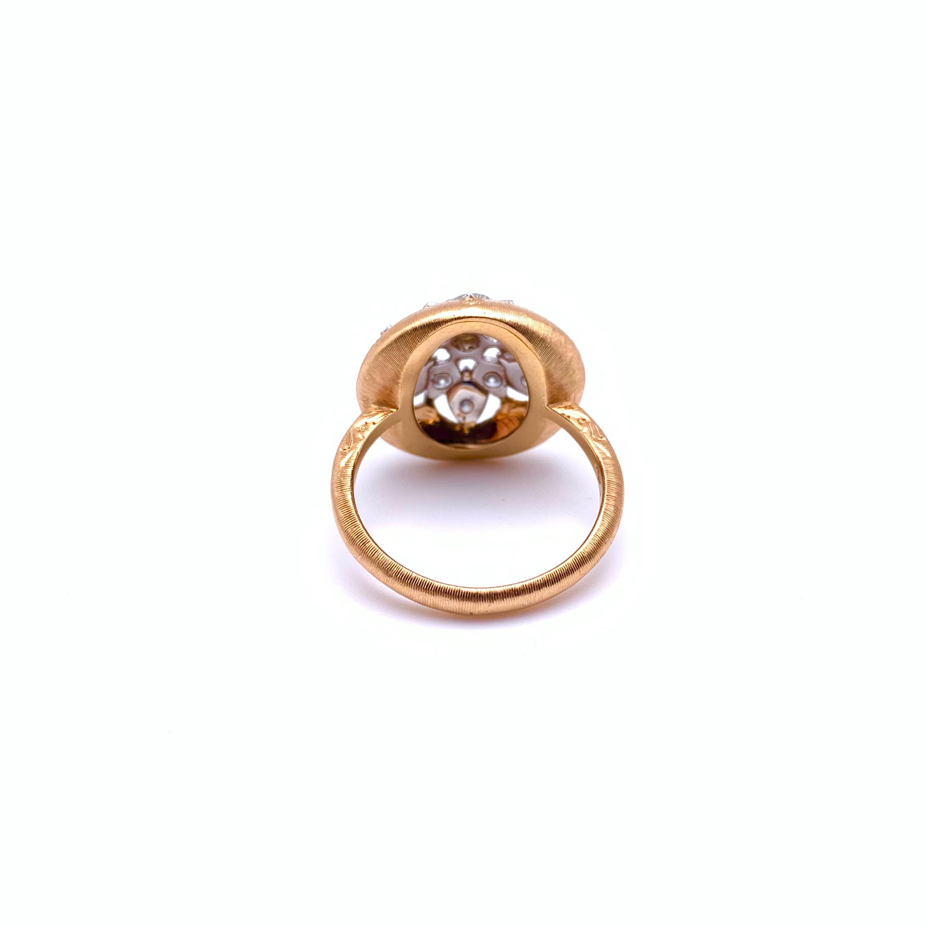 This sweet ring has soft contours and lots of sparkle. It was handmade by a family jeweler outside of Florence, Italy with each detail being carved into the gold by hand. This engraving technique has been practiced in Florence for over 600 years. It
