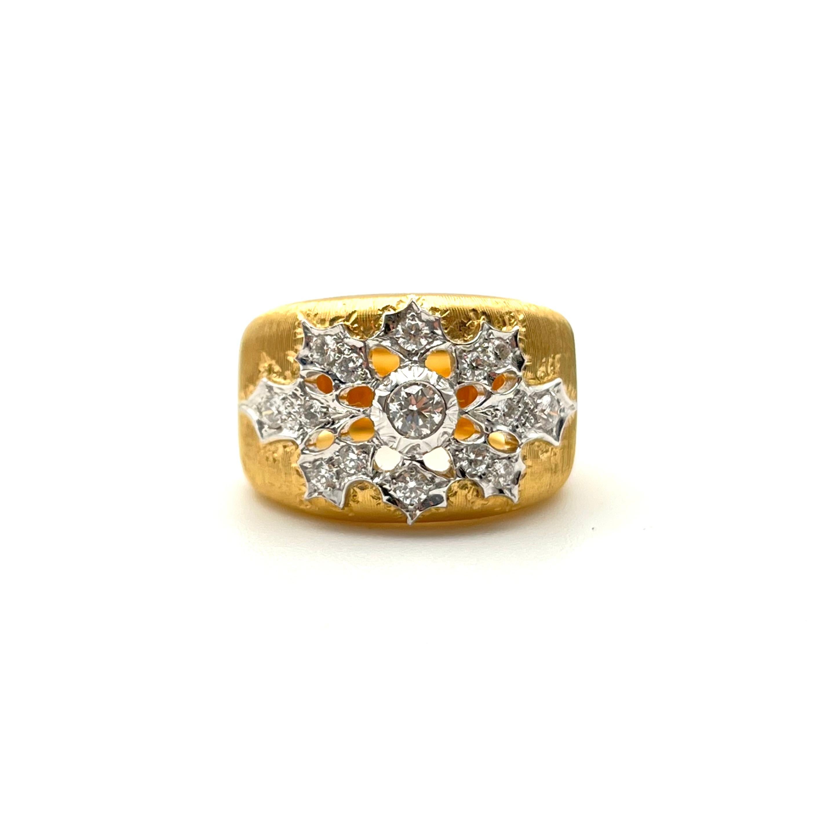 This regal, tapered diamond band was handcrafted by a family jeweler outside of Florence, Italy. Each line is hand-etched to give it a lustrous silk effect. This ring is made from solid, 18-karat yellow gold with white gold details. The shank bevels