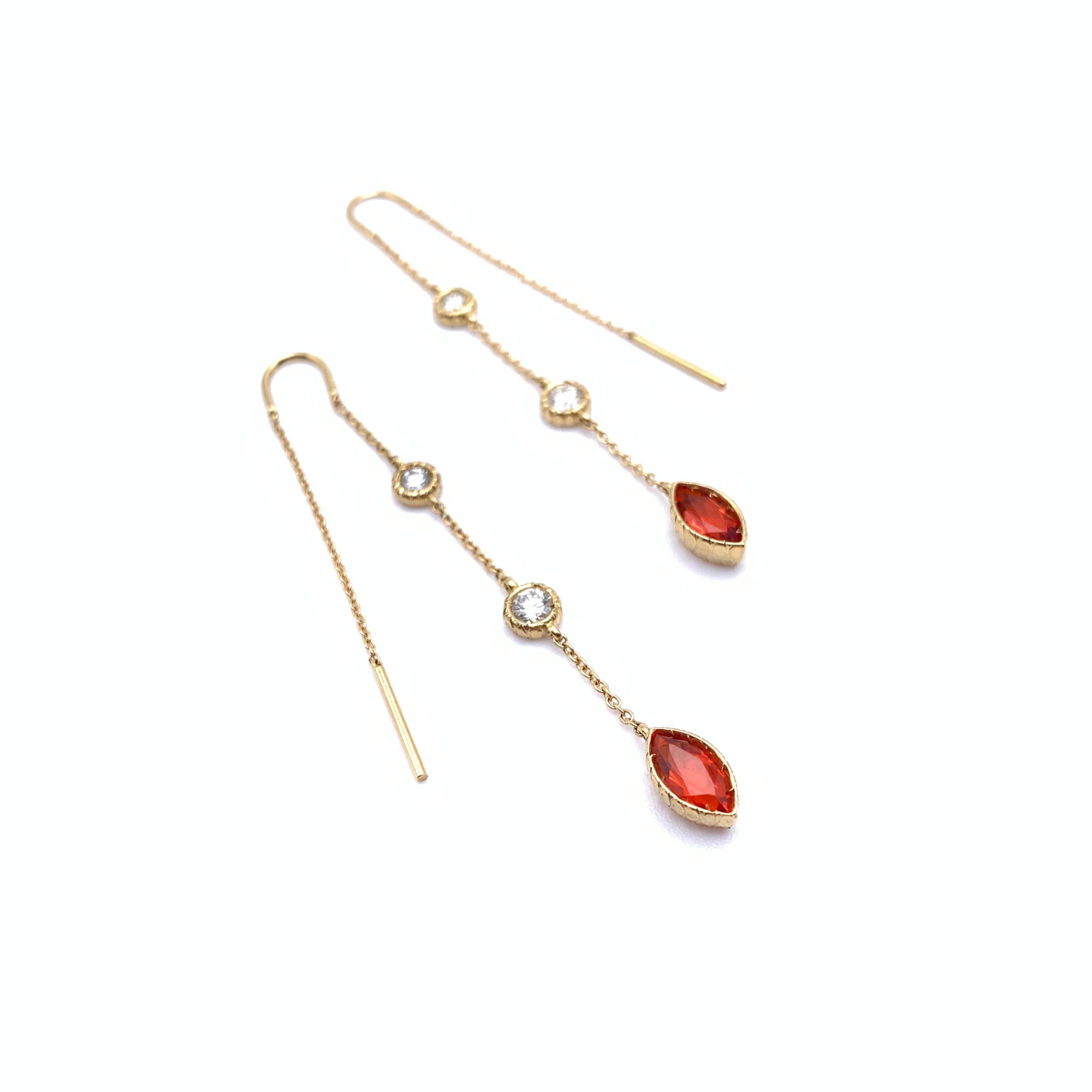 These gorgeous earrings were designed by our staff and made by a multigenerational goldsmith in Florence, Italy. They feature a modern thread design and are set in 18-karat yellow gold. They are set with four round, full-cut diamonds measuring .54