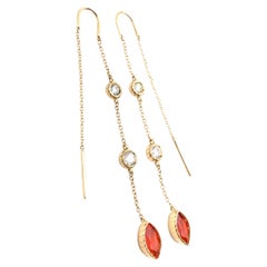 Pendientes de rosca con topacio imperial y diamantes grabados en florentino de 18 quilates