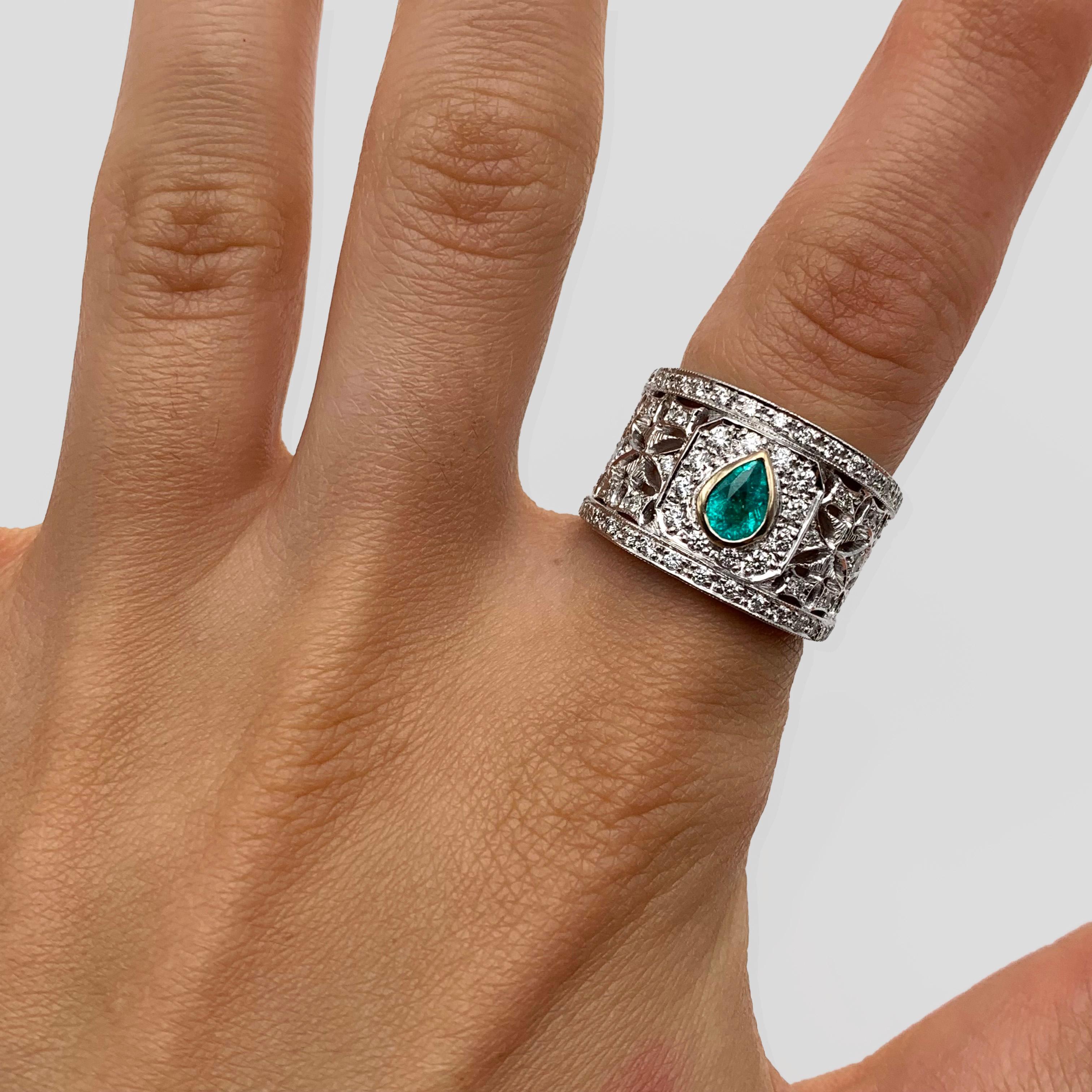This luxurious cigar band features one gorgeous Brazilian Paraiba Tourmaline weighing .59 carats. Paraiba Tourmalines bear the element copper, turning them a rich, littoral shade of blue. They are the rarest gemstones in the jewelry trade today! The