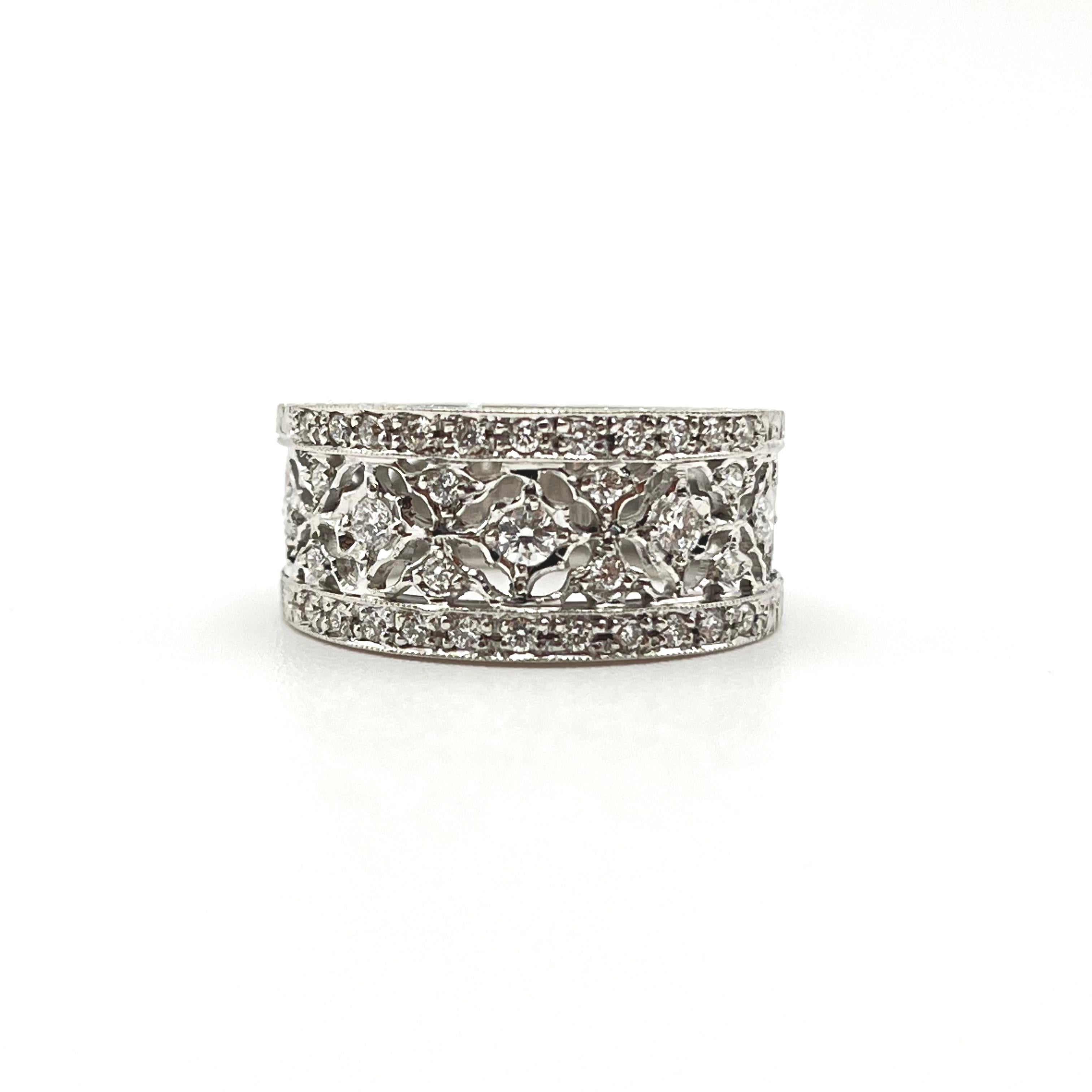 Low profile and stunning, this band makes a perfect addition to a classic jewelry collection! This regal diamond band was handcrafted by a family jeweler outside of Florence, Italy with each detail being individually carved. A testimony to