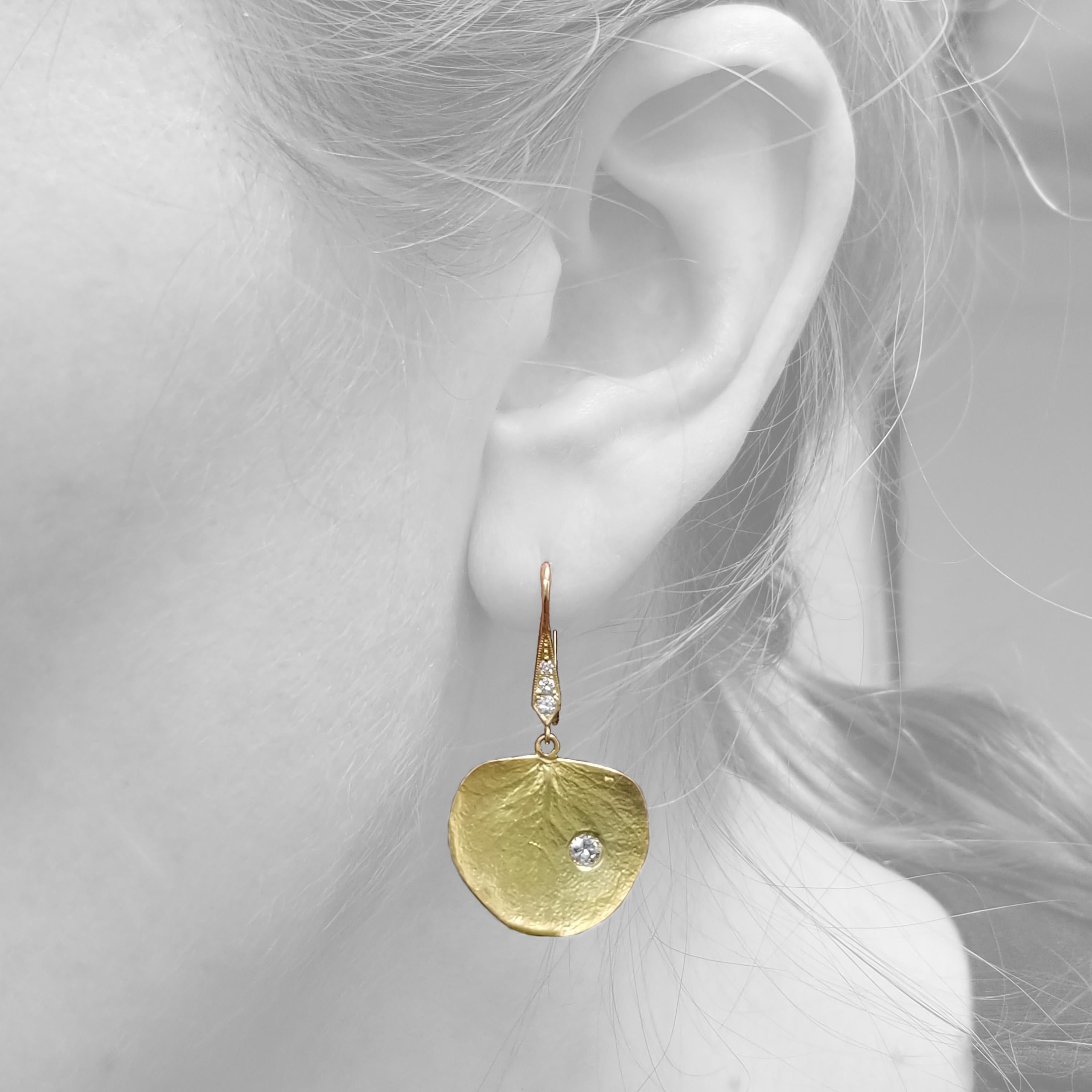The fresh smell of eucalyptus can accompany you everywhere with these playful and effortlessly chic earrings. The finely detailed leaves are executed in such a way that the impossibly perfect veins within the leaf will catch both the light and the