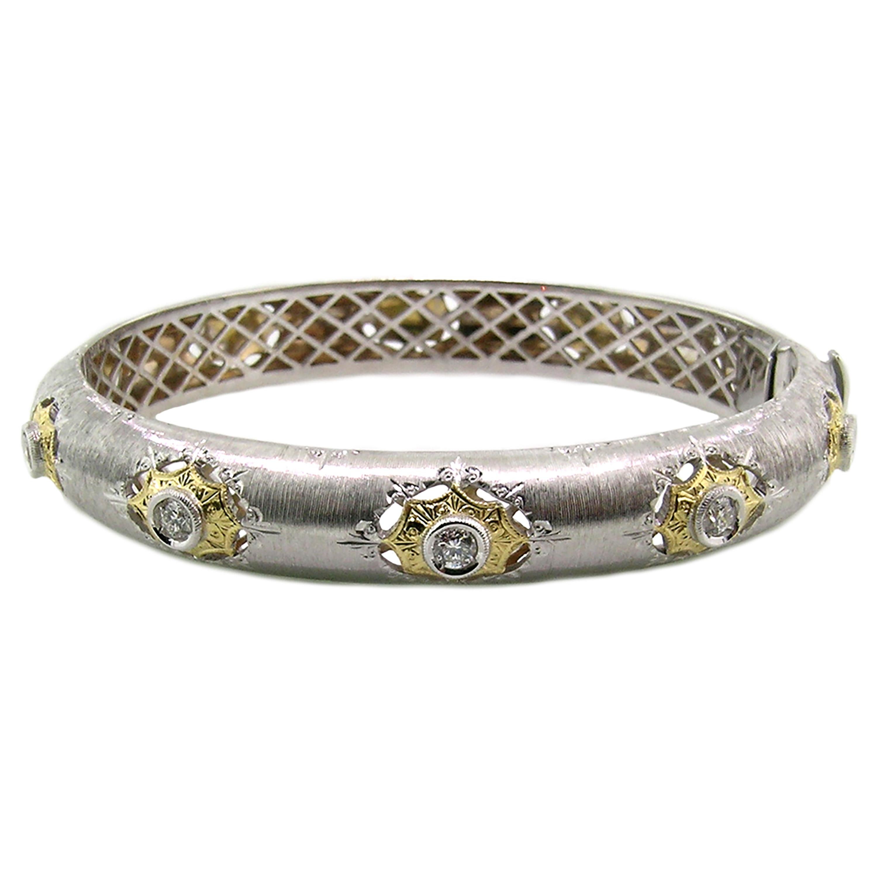 The execution and quality of the Olympia bangle are old-world, but the style is bold and modern. The two tone bangle is entirely finished in hand-engraved details which date back to the Italian Renaissance.

This bangle is oval-shaped, both for