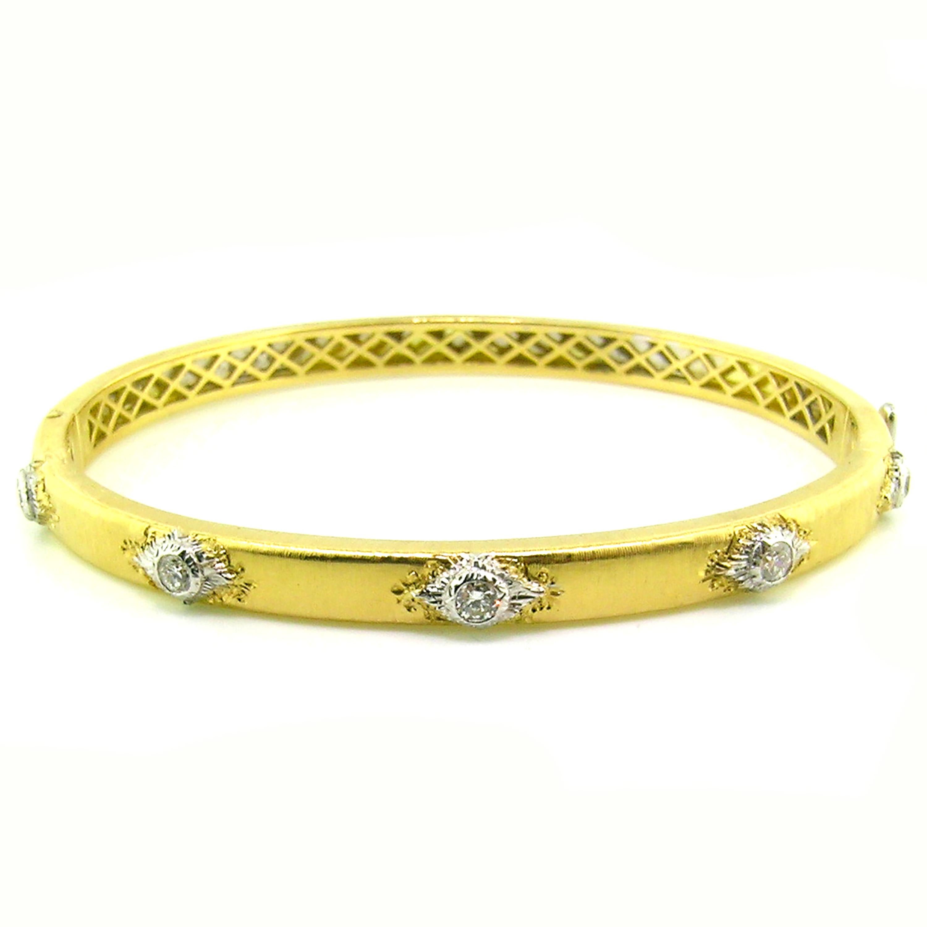 The Valentina Bangle is a classic staple for any jewelry wardrobe. Exquisitely executed details and fine diamonds are framed in an oval bangle which is perfectly suited to everyday wear. This bangle is especially fantastic when stacked in all three
