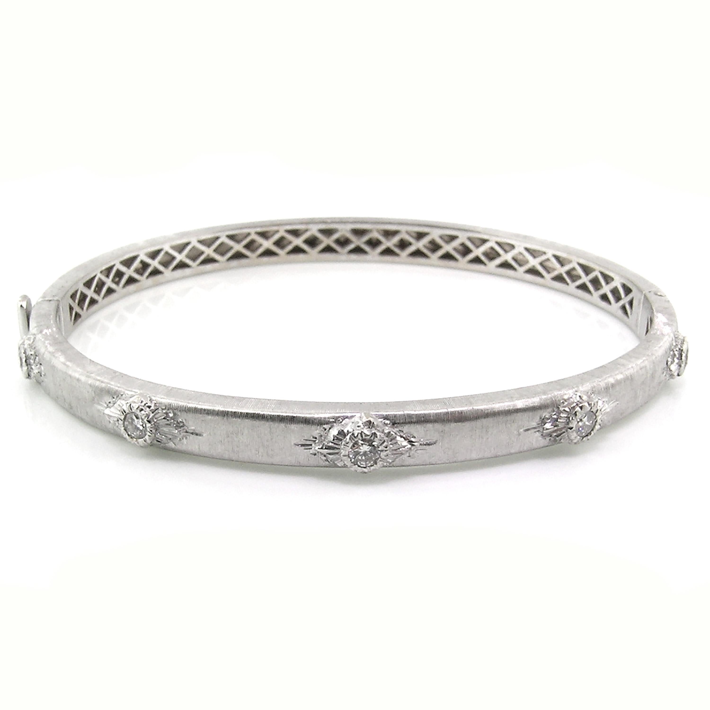 The Valentina Bangle is a classic staple for any jewelry wardrobe. Exquisitely executed details and fine diamonds are framed in an oval bangle which is perfectly suited to everyday wear. This bangle is especially fantastic when stacked in all three