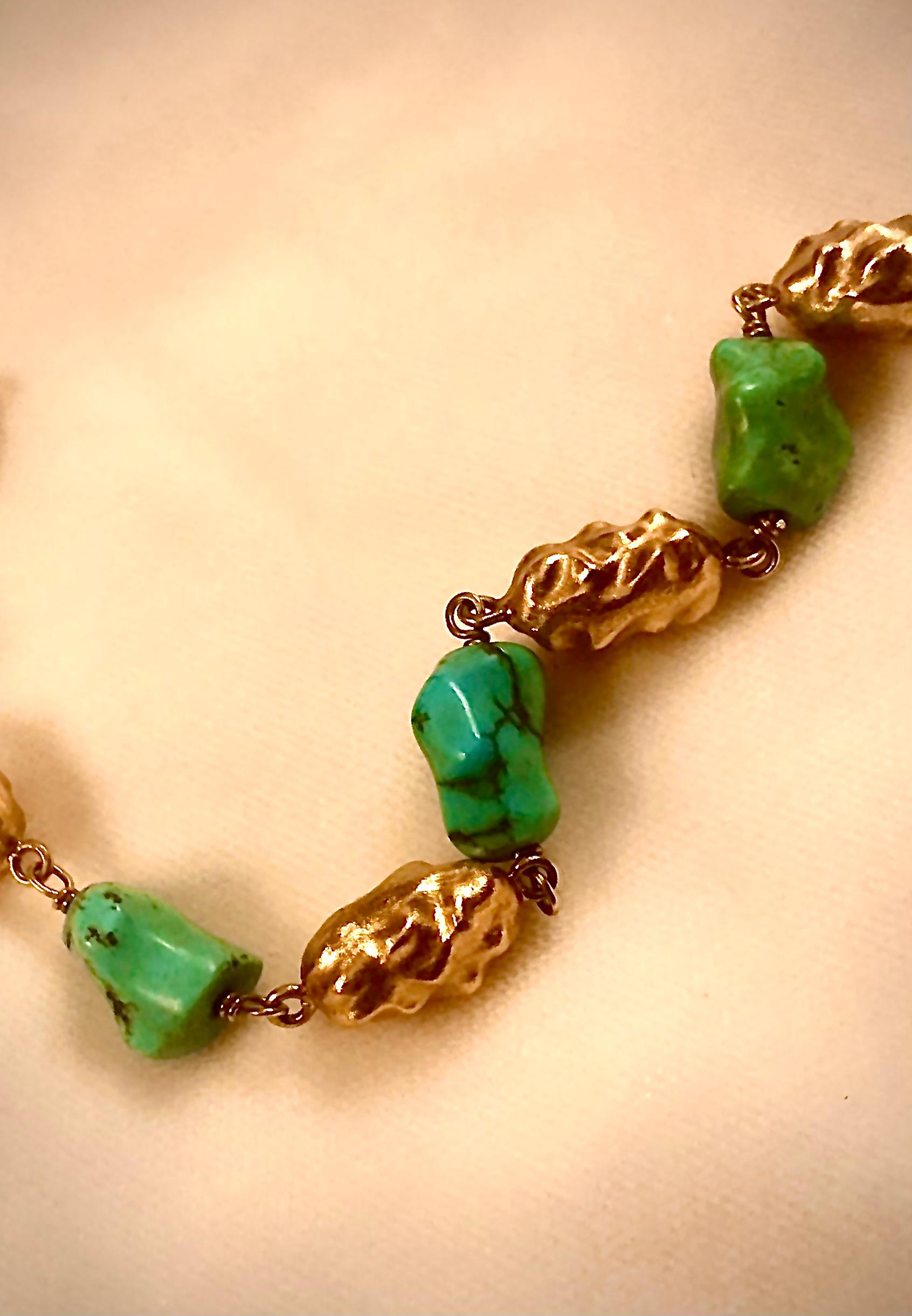 Stunning and unique 18kt. gold and turquoise bracelet.

This unusual design is of nuggets of fine blue/green turquoise with an average size of 12.5mm X 7.2mm.

Joining the turquoise beads wonderfully amusing 18kt. golden nugget form beads.

While