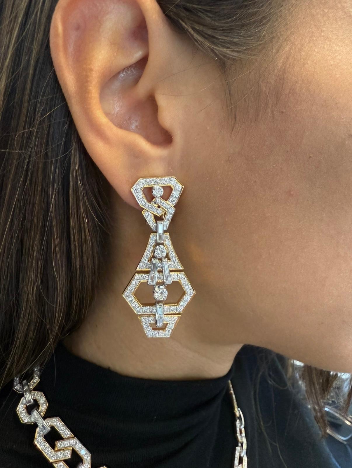 Presenting an exquisite Art Deco inspired SET, masterfully crafted from 136 grams of luxurious 18Kt gold. The captivating pieces are adorned with 574 round diamonds totaling 19.12 carats G-H color and VS to SI clarity, each stone meticulously