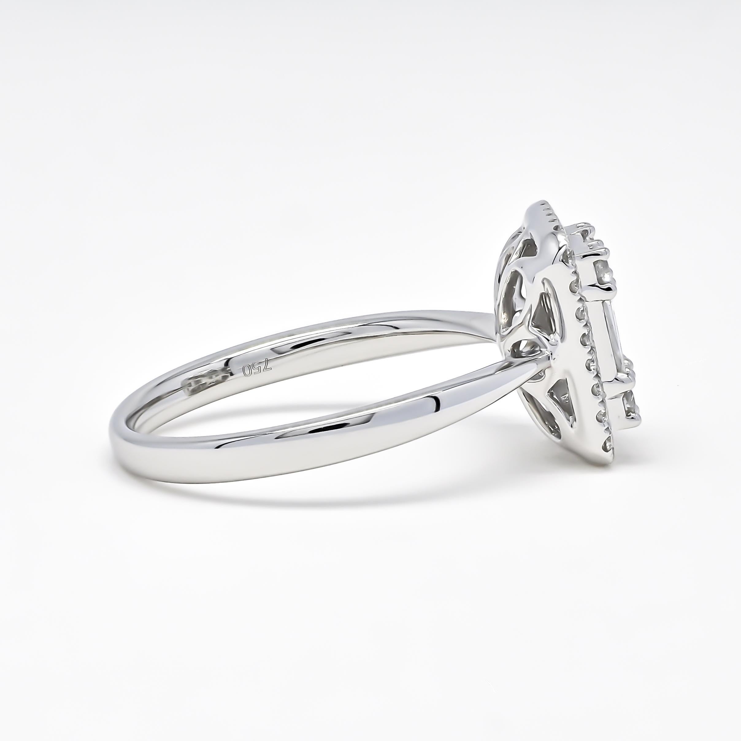 A diamond cluster ring with baguette and round diamonds is a beautiful and sophisticated choice for a dainty engagement ring. The ring features a cluster of diamonds in the center, which includes both round and baguette-cut diamonds, adding a unique