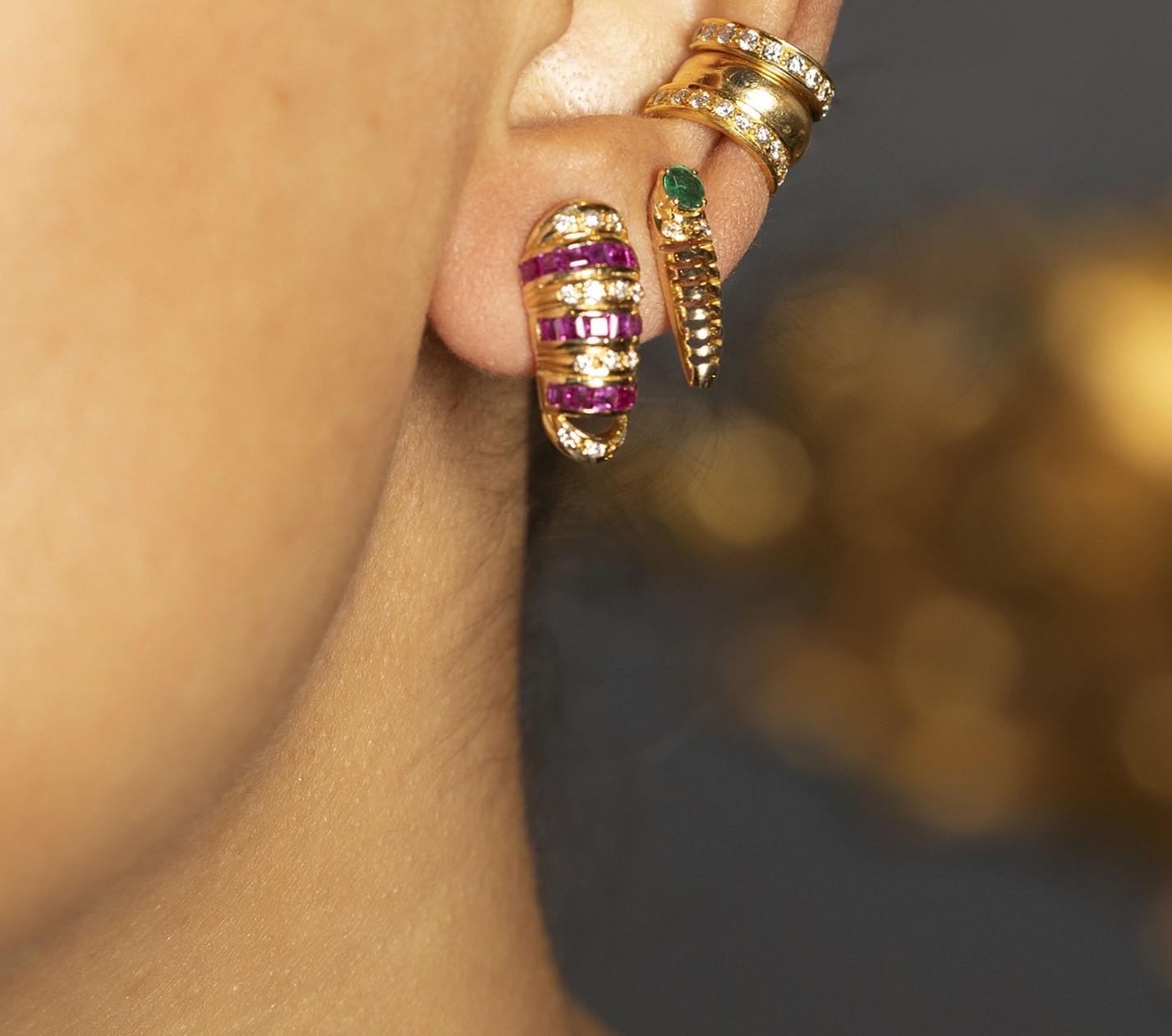 18kt Gold Baguette Ruby & Diamond Stud Earrings. Set on18kt Gold with 0.52 carat round brilliant cut diamonds & 1.80 carat of baguette rubies.

2 cm in full length. Very light weight for pierced ears.

Consciously sourced natural stones &