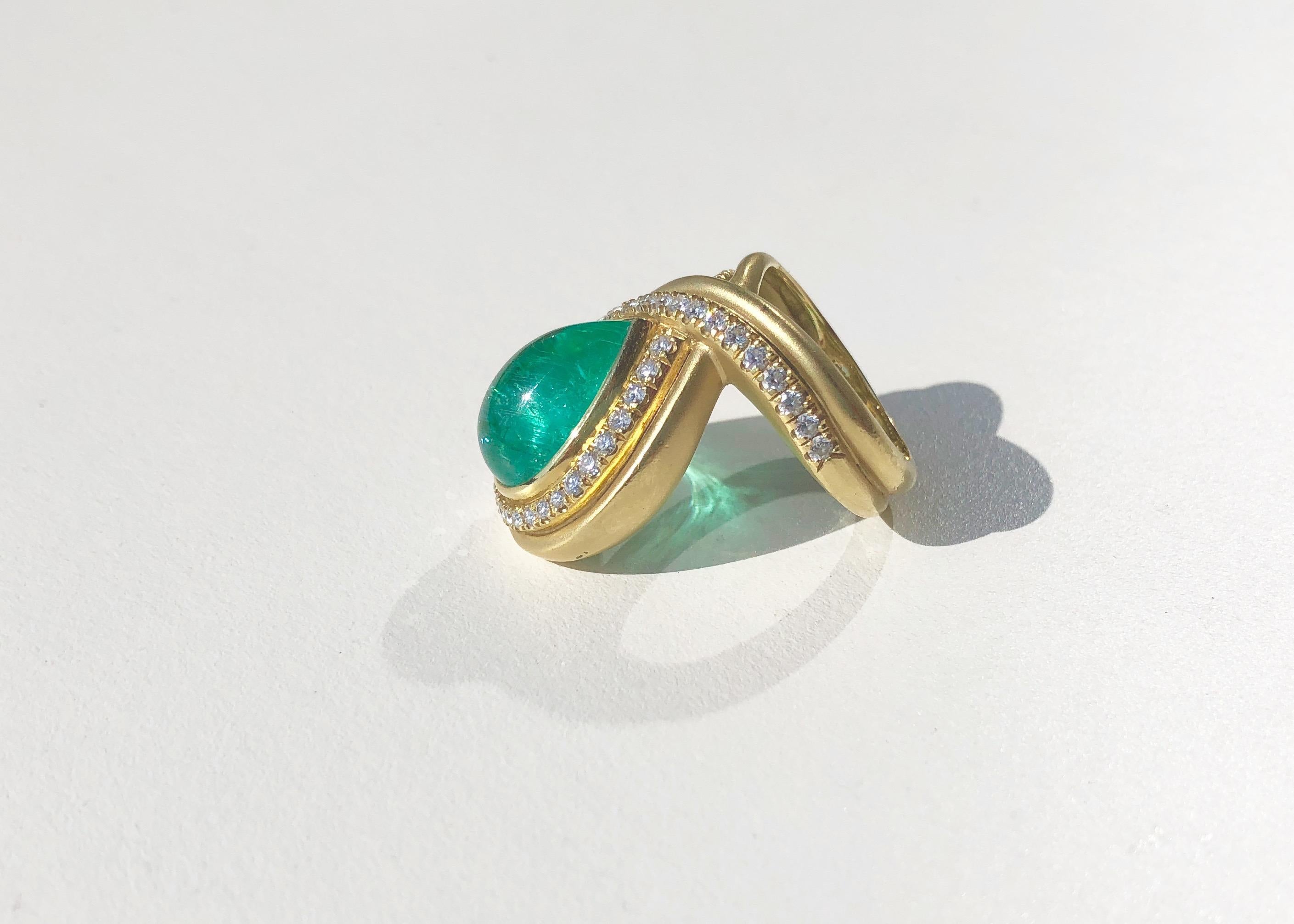 This show-stopper is a Paraiba Tourmaline (Mozambique) surrounded by a ribbon of Diamonds set into an 18kt Gold Band reminiscent of creations from the Mughal Empire. (Size 7.5)

