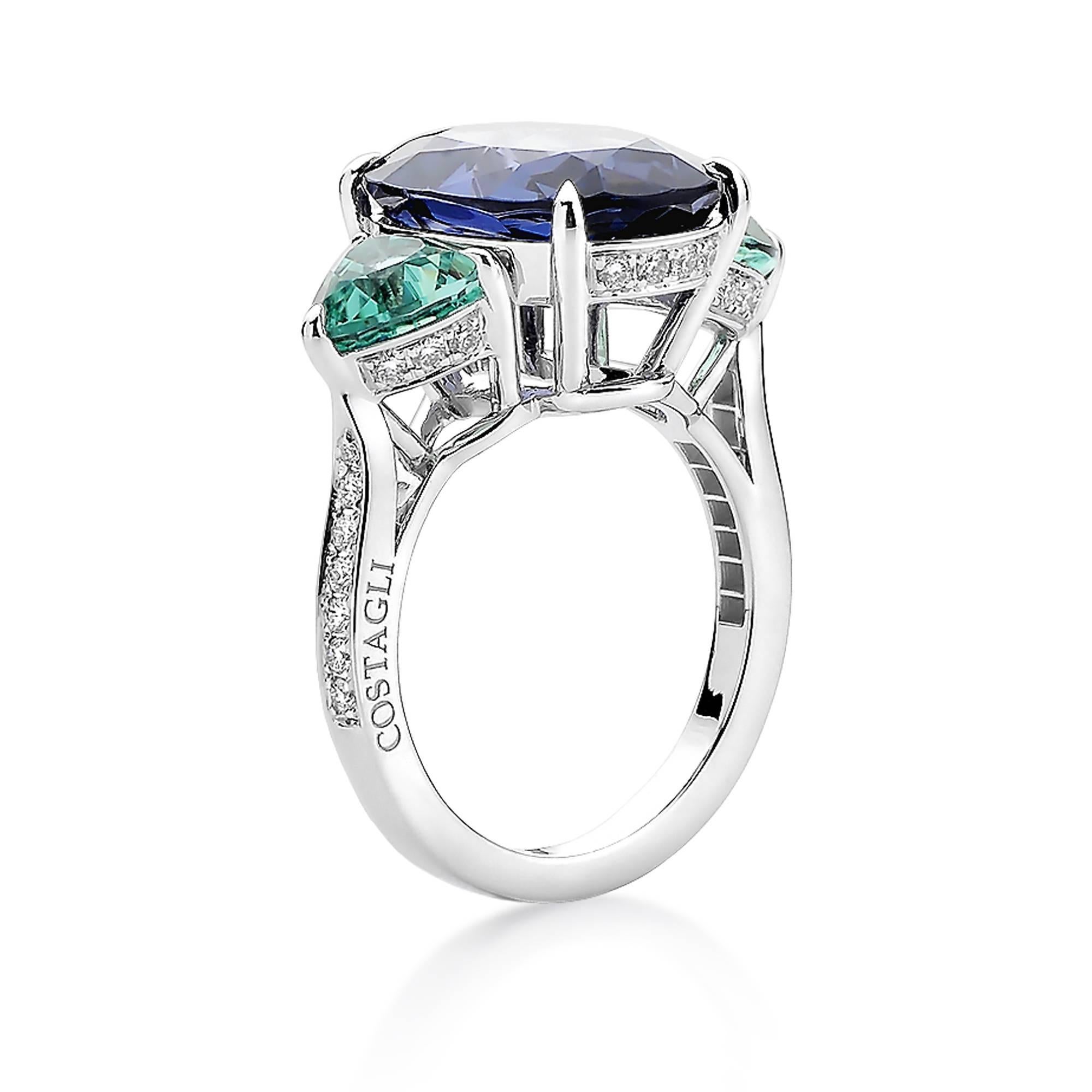 One of a kind cushion shape blue spinel 8.18 carat ring flanked by trillion shape lagoon tourmalines, 2.32 carats set in 18kt white gold with pave-set round, brilliant diamonds, 0.33 carats.

Clean lines, perfection of cutting techniques, exquisite