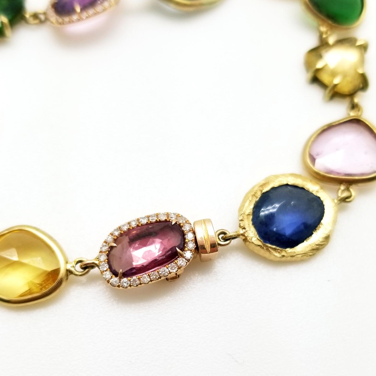 Women's 18KT Gold Bracelet with diamonds, tsavorites and blue, pink and yellow sapphires