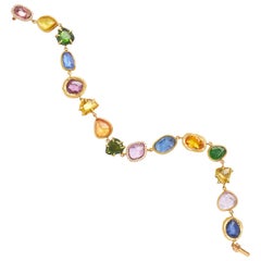 18KT Gold Bracelet with diamonds, tsavorites and blue, pink and yellow sapphires